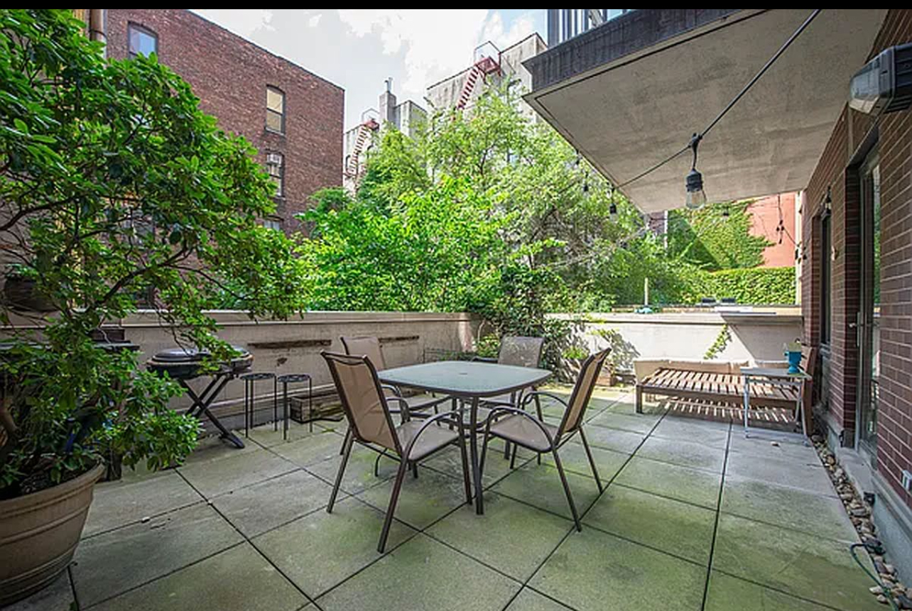 353 East 104th Street, Unit 5A Manhattan, NY 10029 - Photo 2 of 4 a view of a patio with a table and chairs