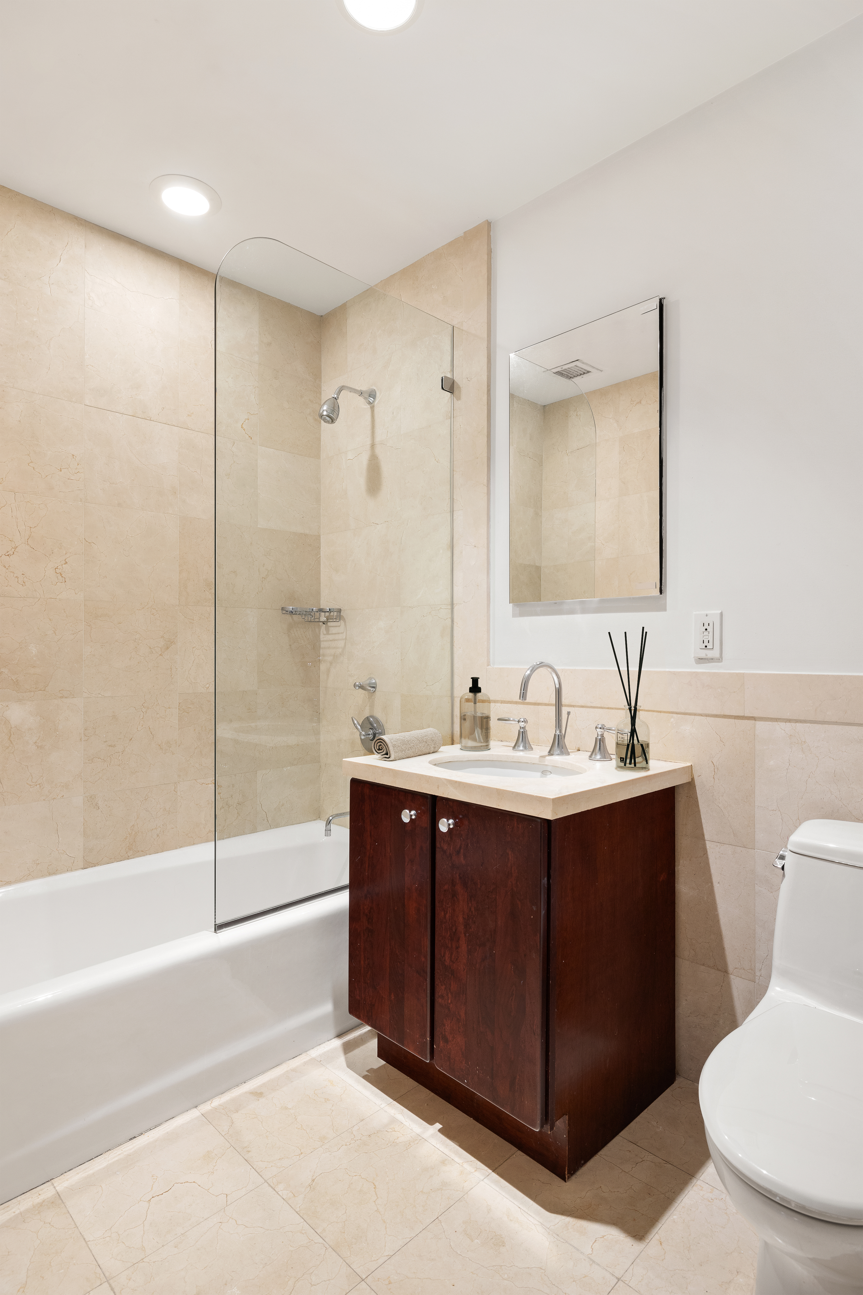 73 Worth Street, Unit 5E Manhattan, NY 10013 - Photo 7 of 10 a bathroom with a bathtub and a sink