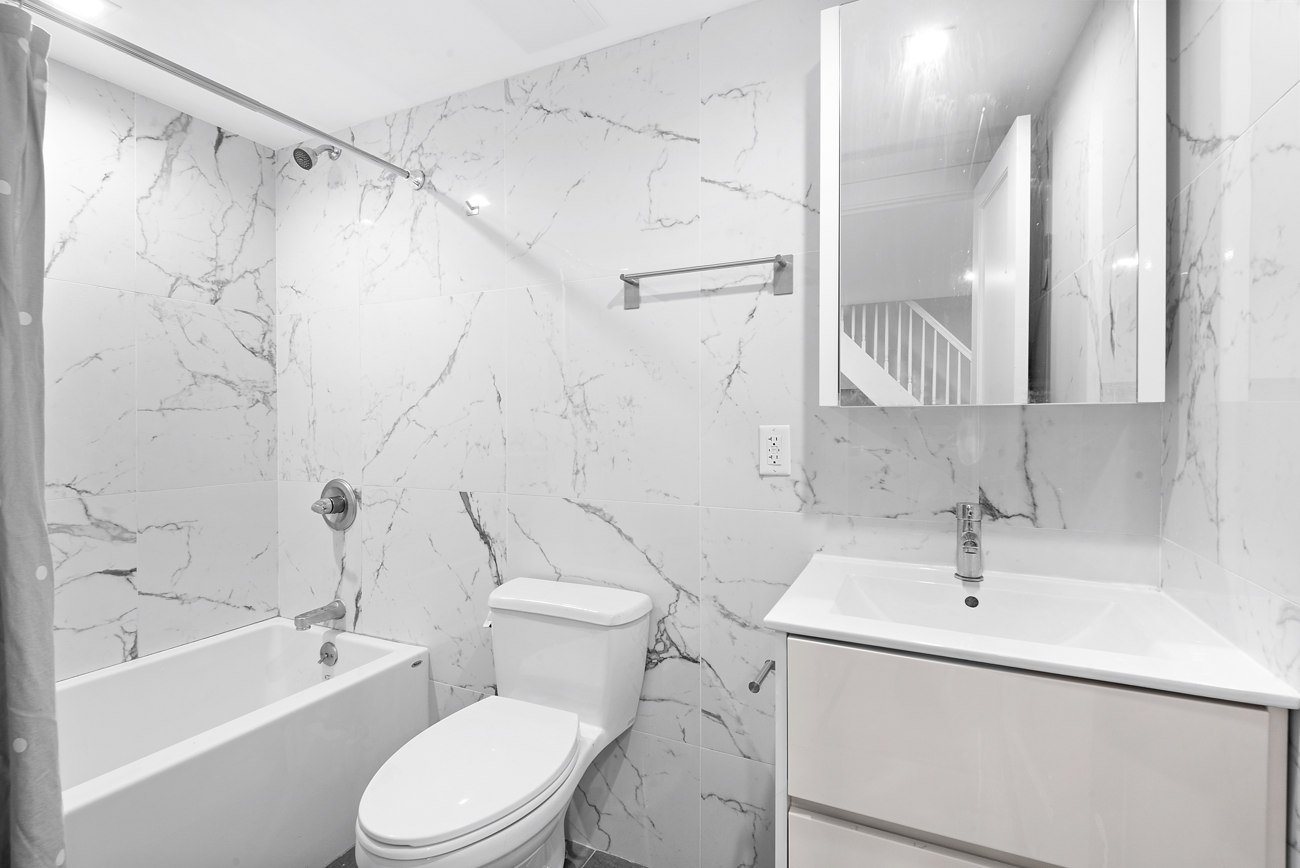 104 Dean Street, Unit 1R Brooklyn, NY 11201 - Photo 5 of 7 a bathroom with a sink a toilet and a bathtub