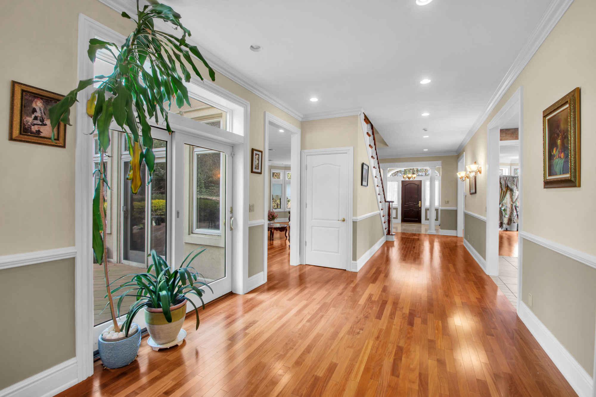 68 Circle Road Staten Island, NY 10304 - Photo 12 of 38 a view of a hallway with wooden floor and a potted plant