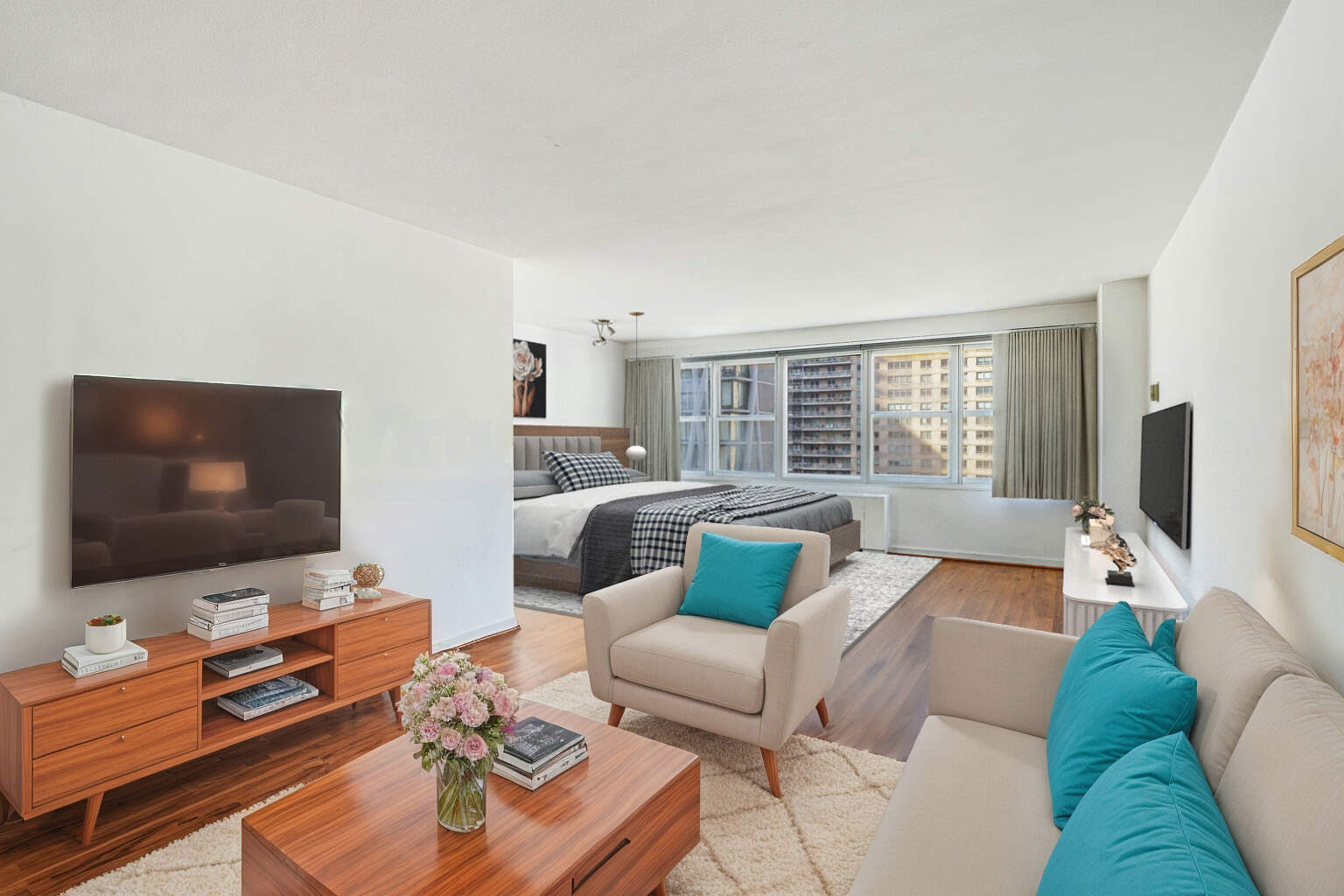 155 West 68th Street, Unit 1907 Manhattan, NY 10023 - Photo 1 of 20 a living room with furniture and a flat screen tv
