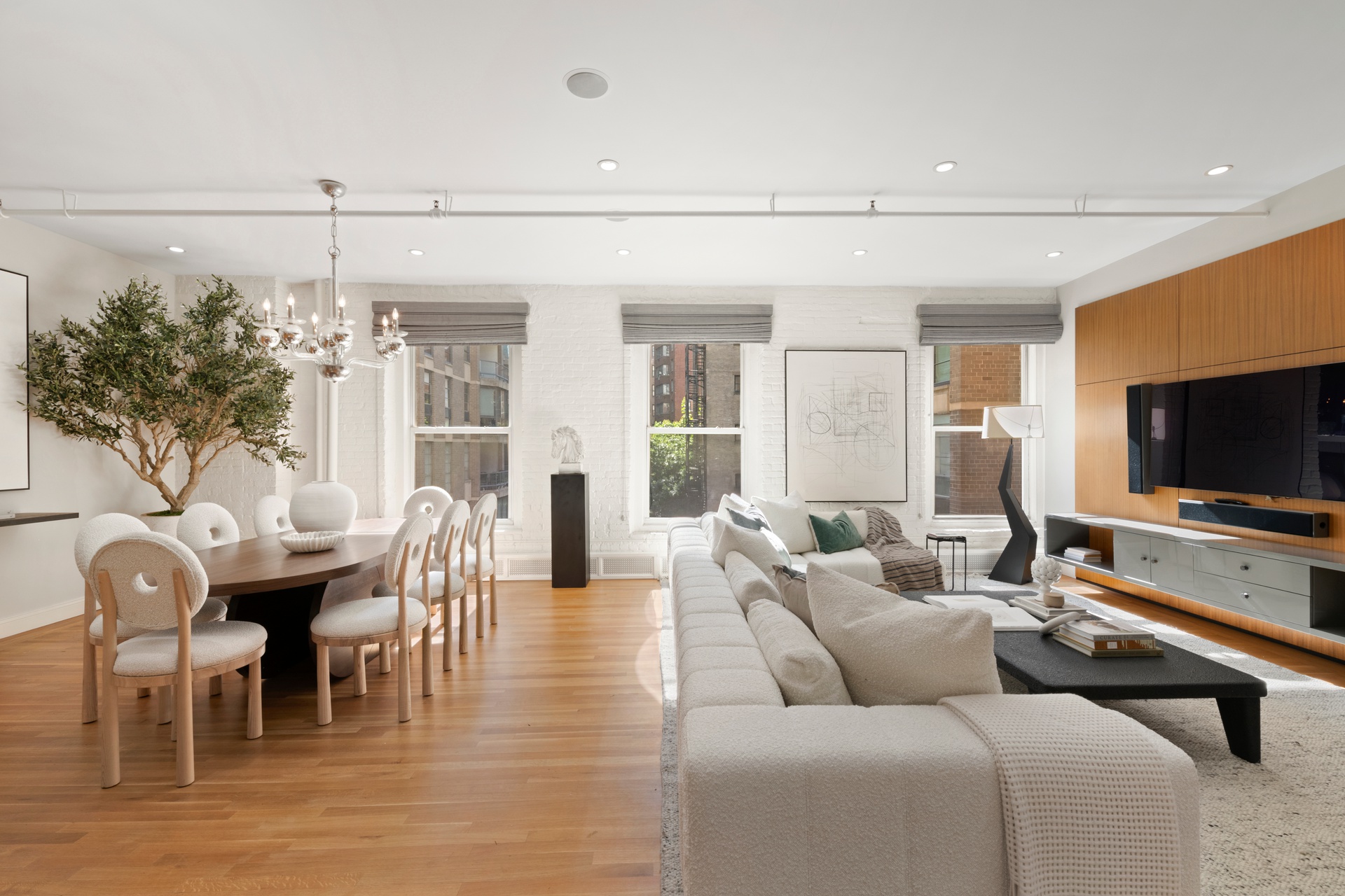 30 West 13th Street, Unit 4C Manhattan, NY 10011 - Photo 5 of 22 a living room with furniture and a flat screen tv