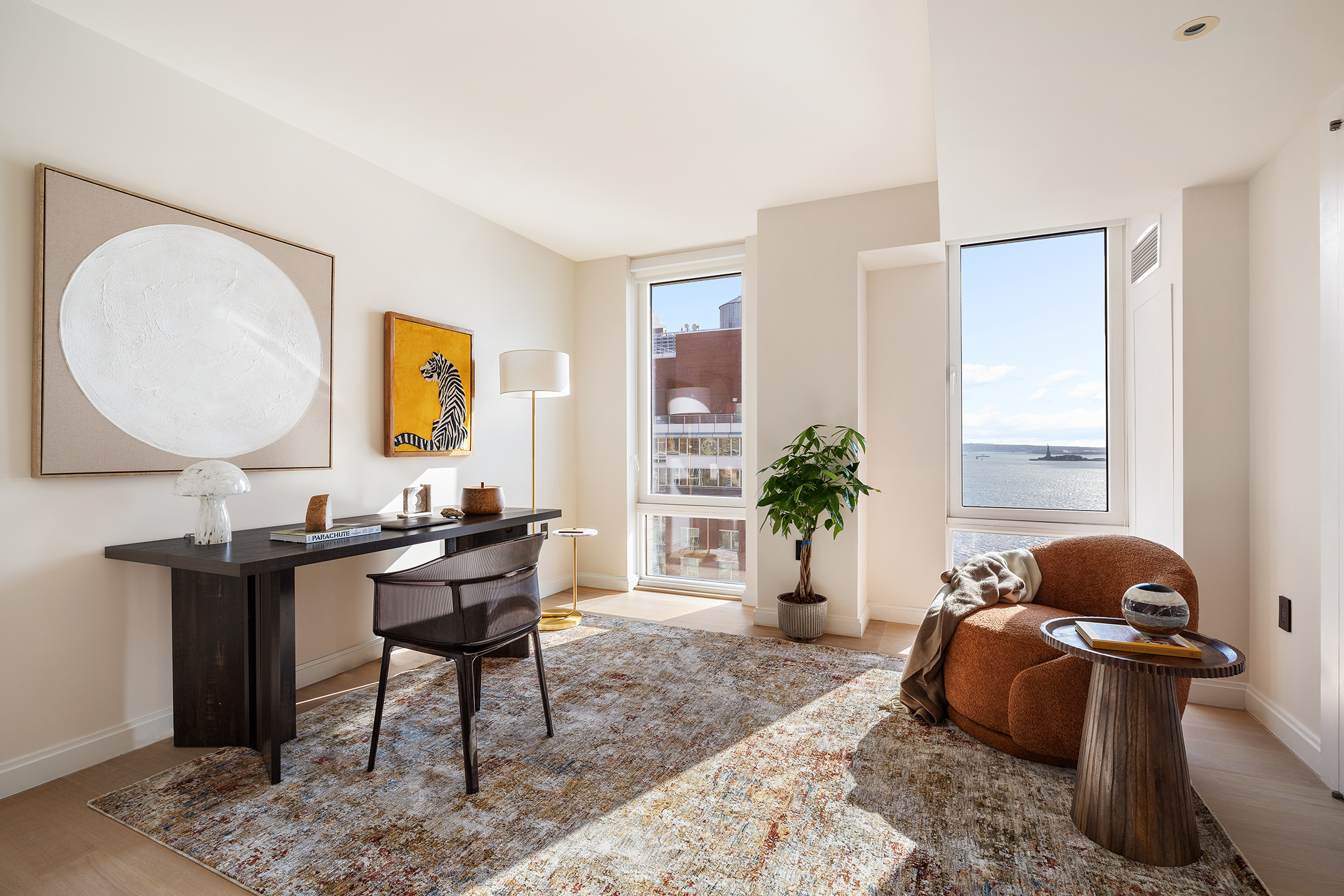 212 Warren Street, Unit PHS Manhattan, NY 10282 - Photo 12 of 18 a living room with furniture a window and a potted plant