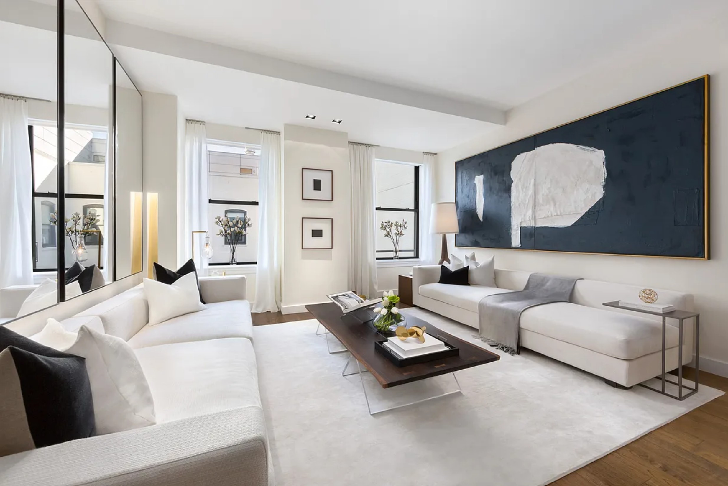 225 5th Avenue, Unit PHY Manhattan, NY 10010 - Photo 4 of 10 a living room with furniture and a large window