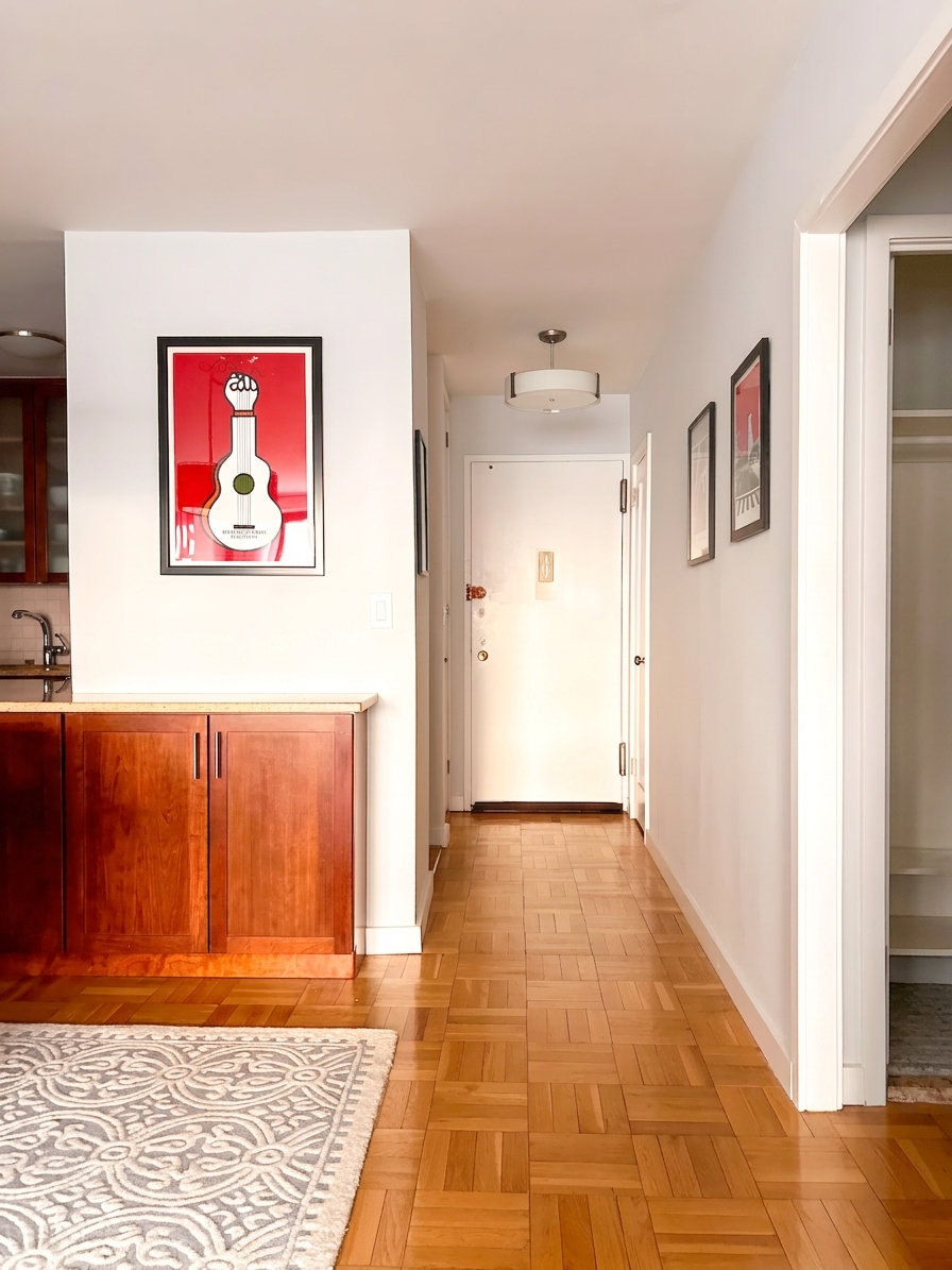 10 West 66th Street, Unit 7C Manhattan, NY 10023 - Photo 9 of 19 a view of a hallway with an empty room