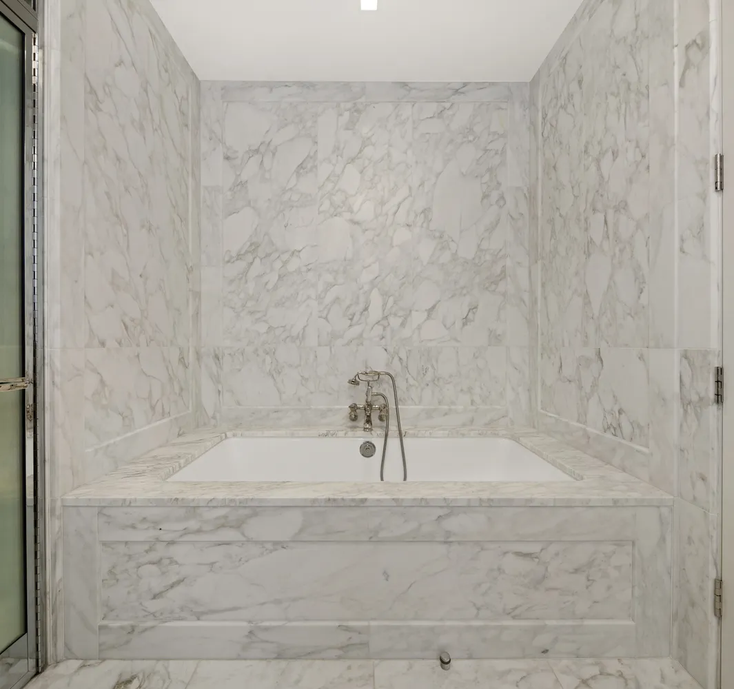 a view of a hallway with seating area