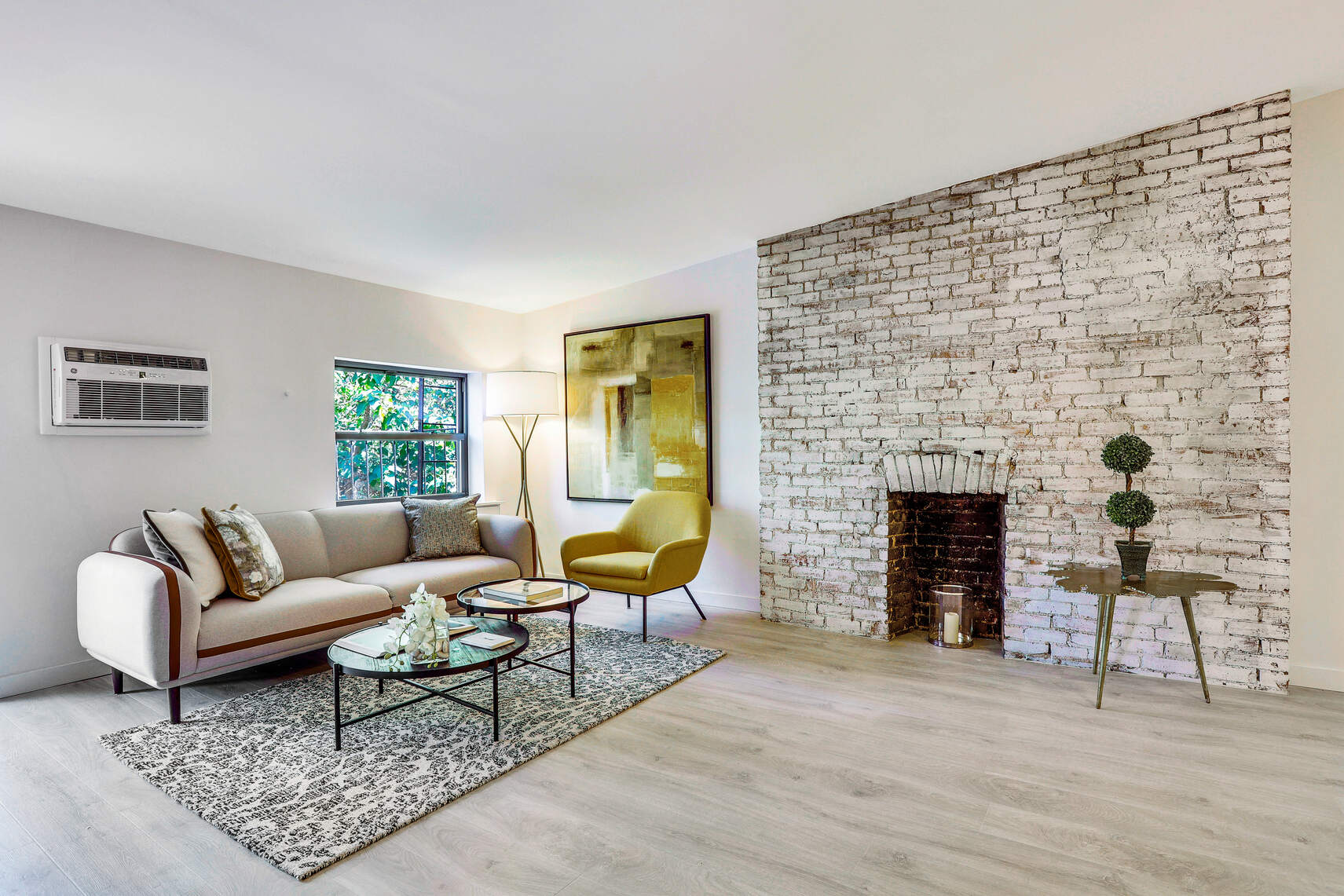 237 East 17th Street, Unit 520 Manhattan, NY 10003 - Photo 4 of 14 a living room with furniture and a fireplace