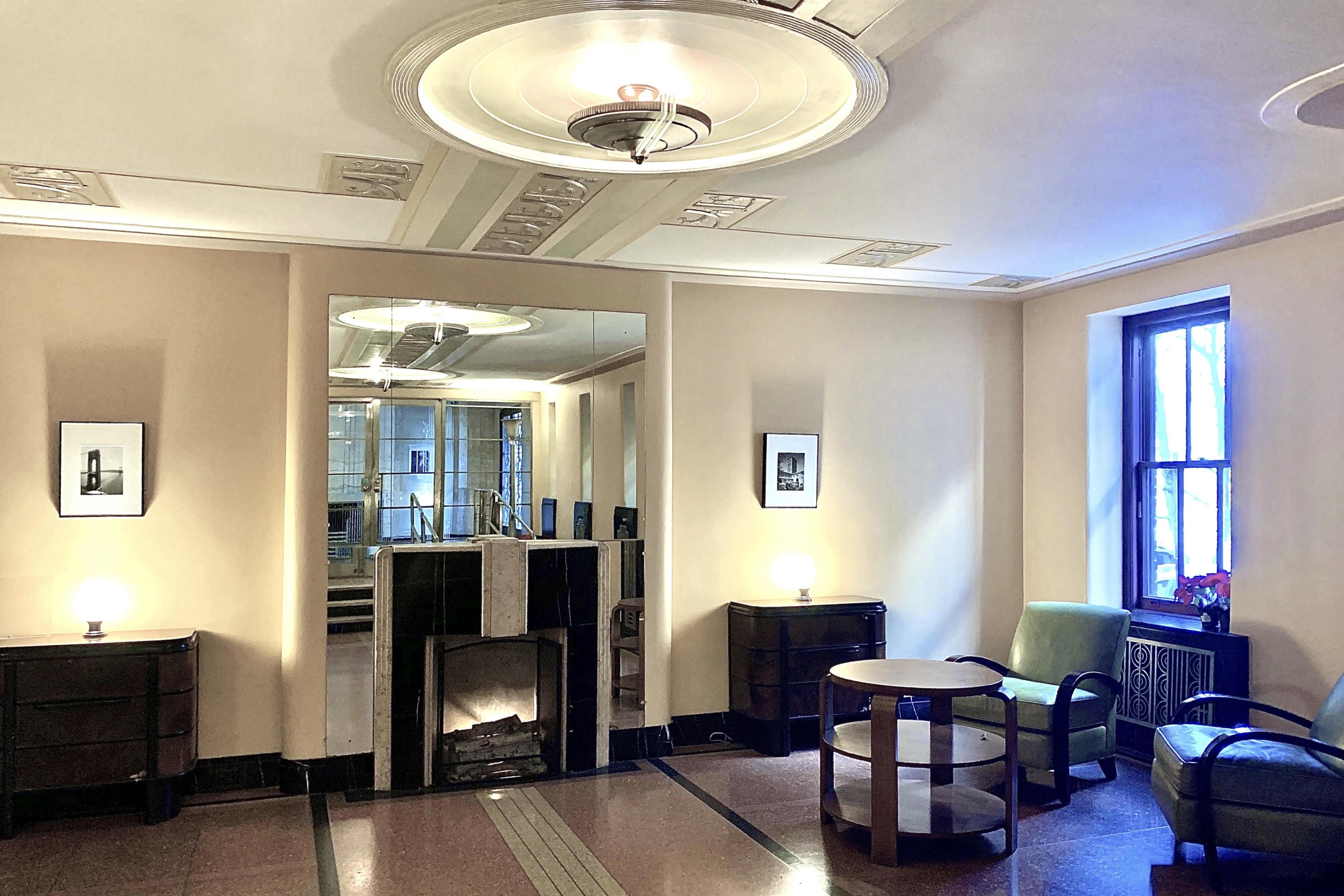 250 Cabrini Boulevard, Unit 1H Manhattan, NY 10033 - Photo 11 of 17 a view of a livingroom with furniture and a window