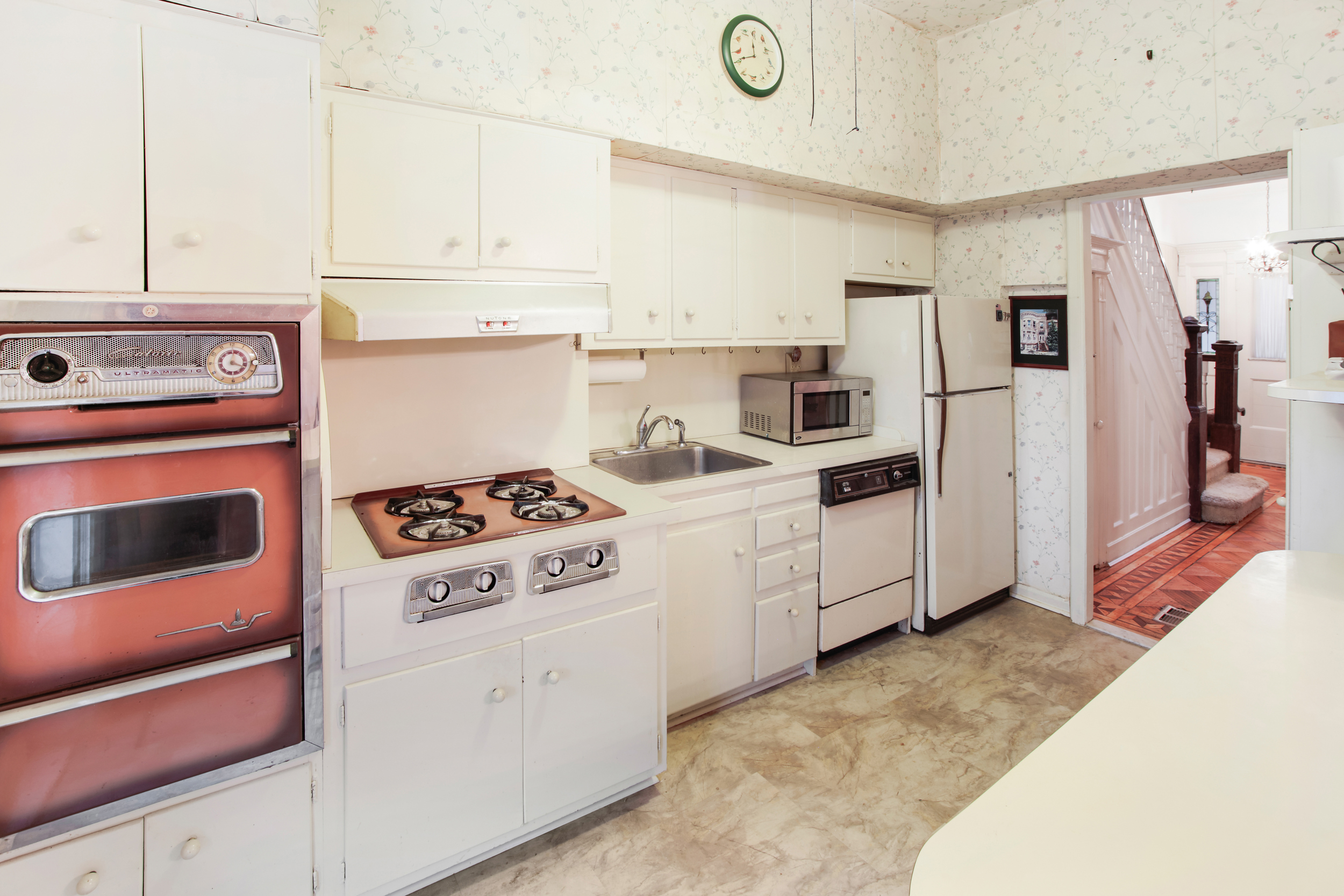 425 81st Street Brooklyn, NY 11209 - Photo 6 of 13 a kitchen with stainless steel appliances granite countertop a stove and a refrigerator