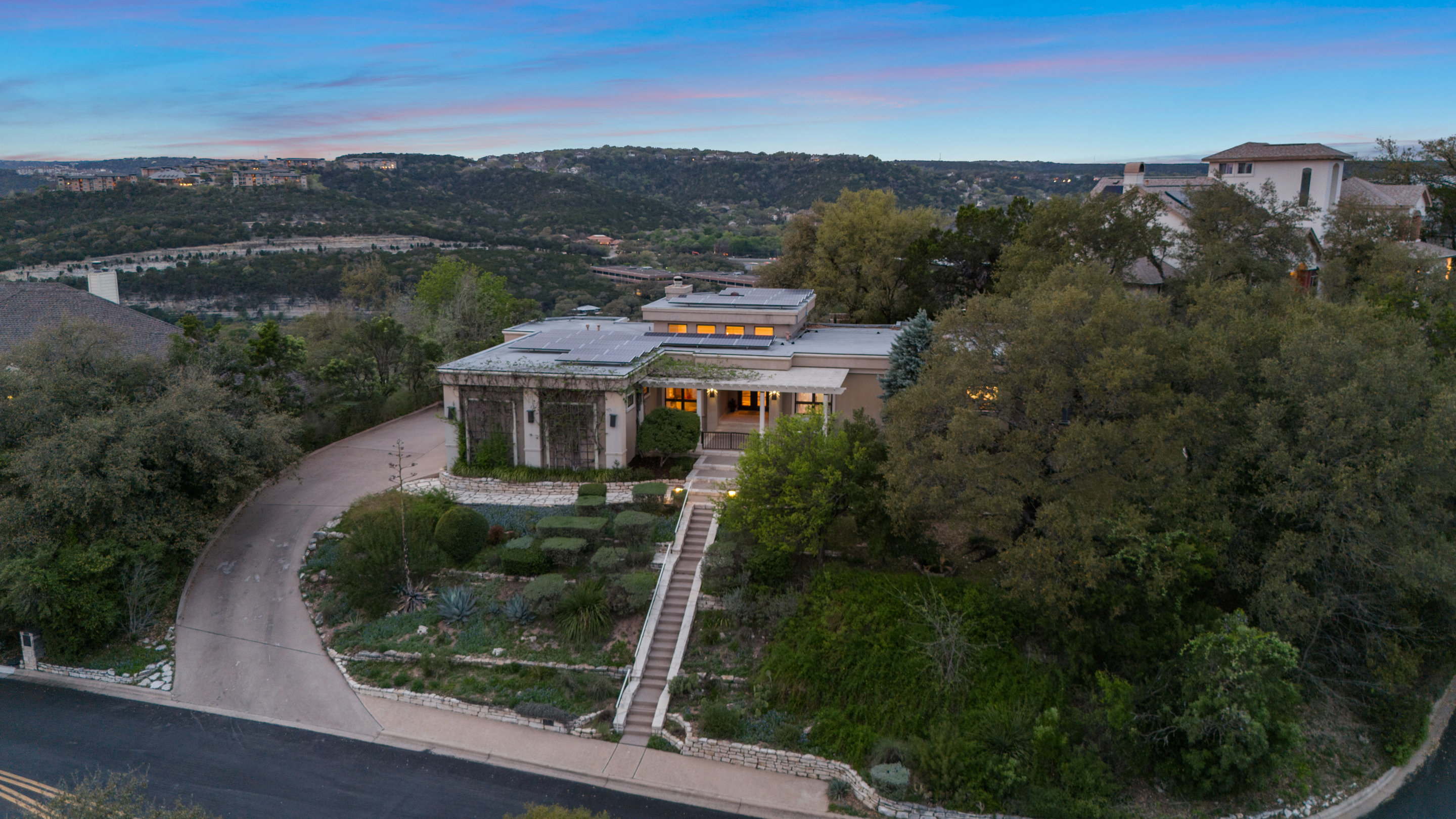 5319 Backtrail Drive Austin, TX 78731 - Photo 33 of 35 an aerial view of a house with a garden and lake view