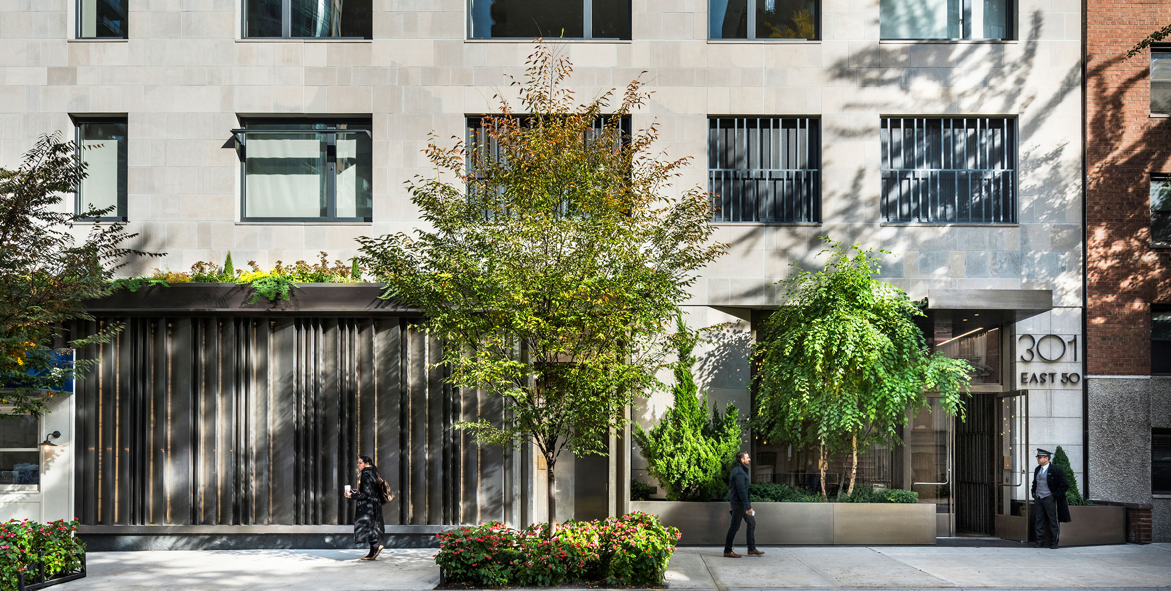 301 East 50th Street, Unit 5A Manhattan, NY 10022 - Photo 18 of 19 a front view of a building with street view