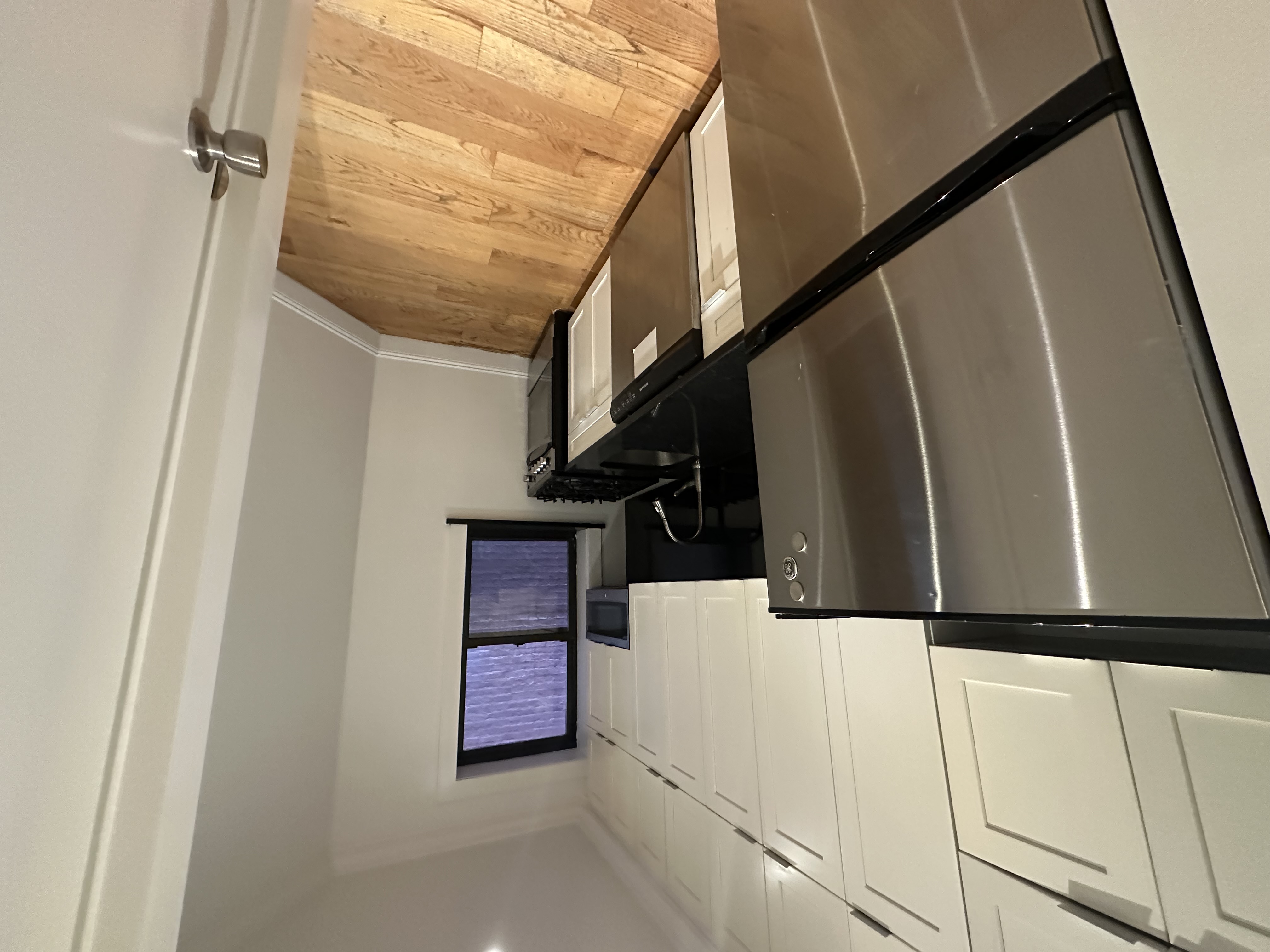 541 West 144th Street, Unit 4 Manhattan, NY 10031 - Photo 2 of 9 a view of a kitchen with appliances