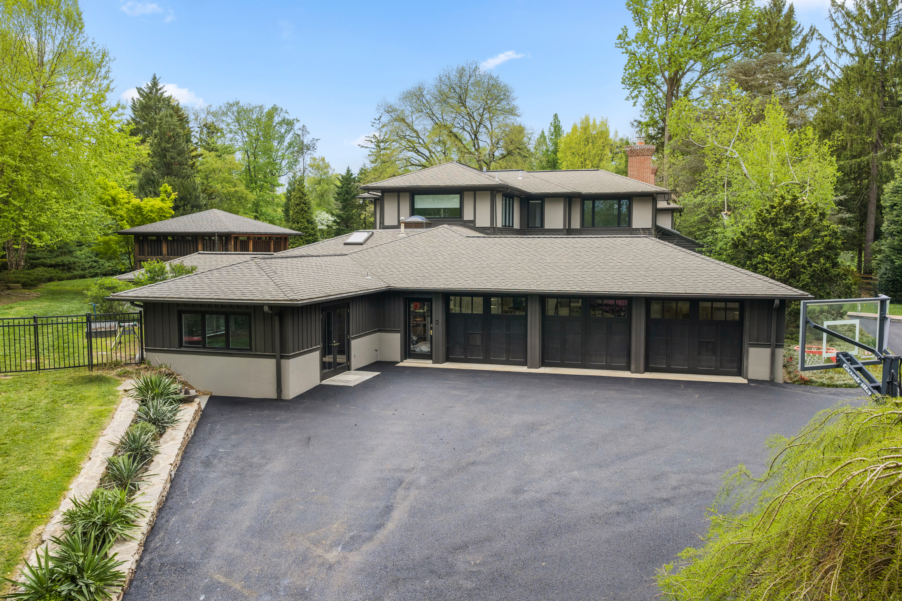 850 Lesley Road Villanova, PA 19085 - Photo 42 of 45 a view of a house with a yard potted plants and a large tree
