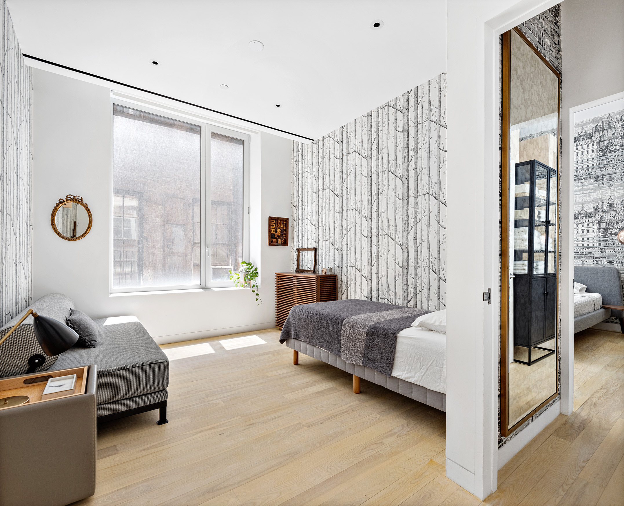93 Reade Street, Unit 3 Manhattan, NY 10013 - Photo 9 of 12 a spacious bedroom with a bed and a large window