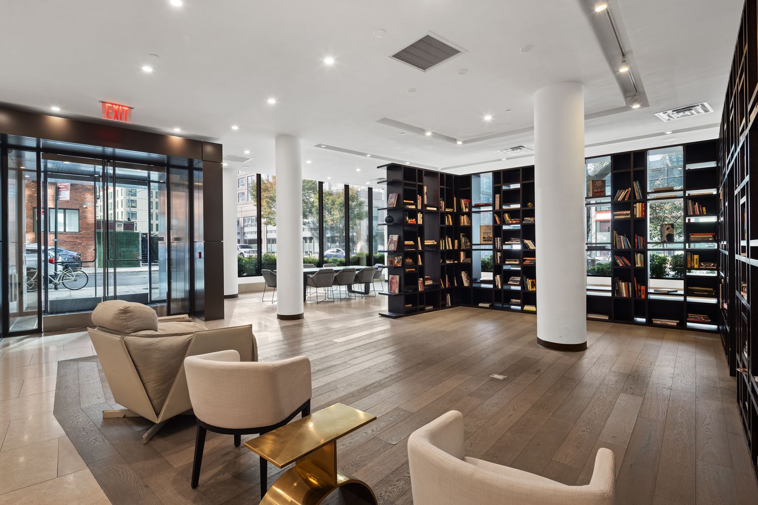 a living room with furniture and hard wood flooring