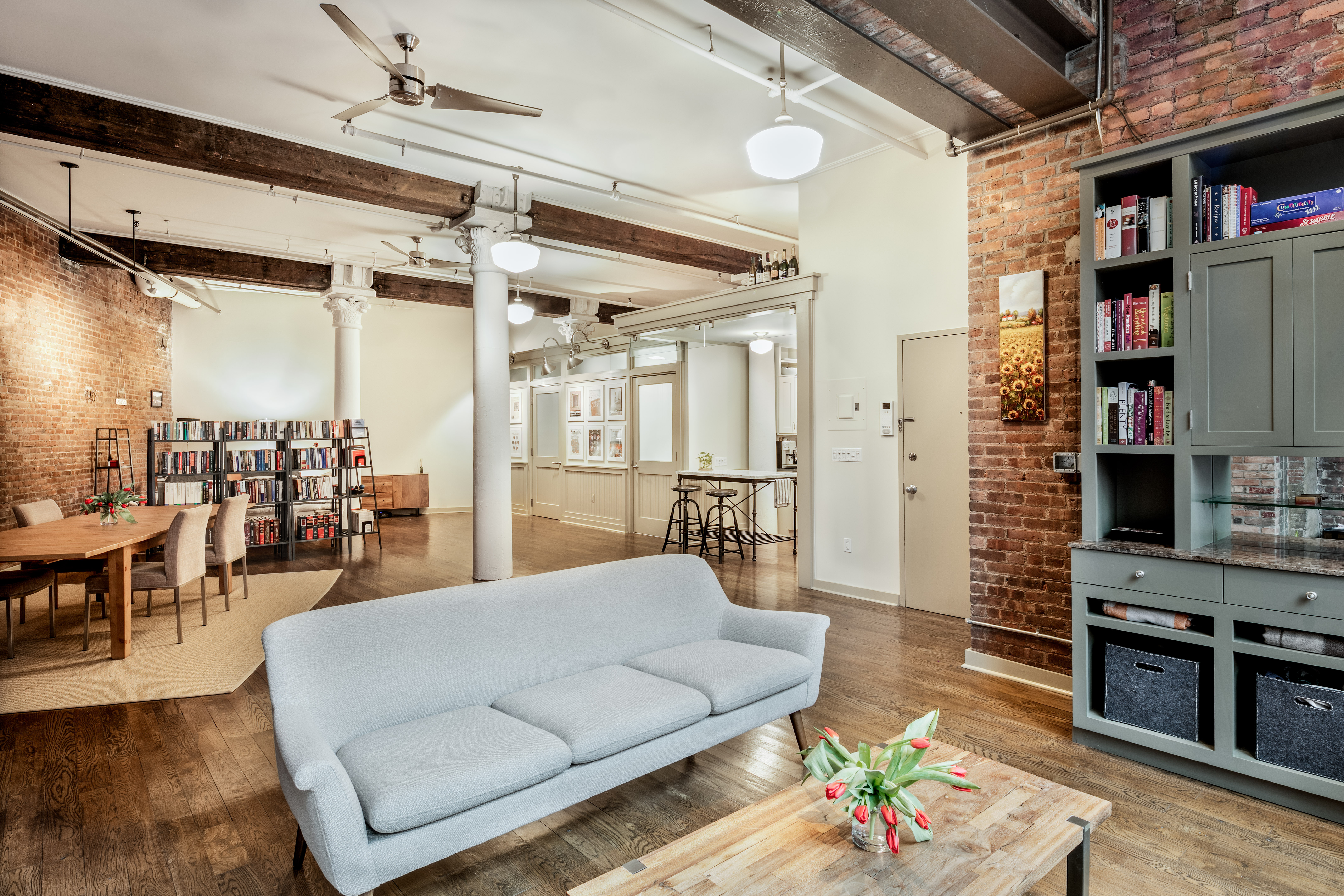 6 Varick Street, Unit 2A Manhattan, NY 10013 - Photo 2 of 6 a living room with furniture and a flat screen tv
