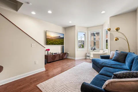 a living room with furniture and a large window
