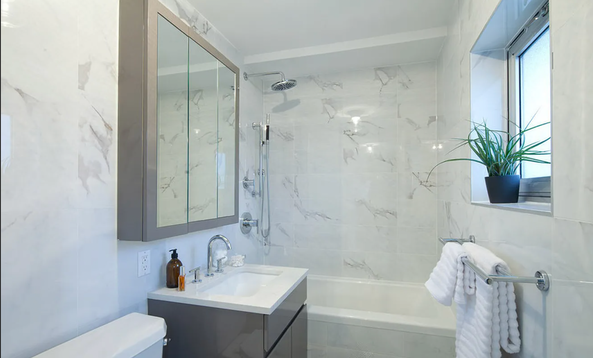 224 Wythe Avenue, Unit 72B Brooklyn, NY 11249 - Photo 5 of 6 a bathroom with a sink toilet and shower