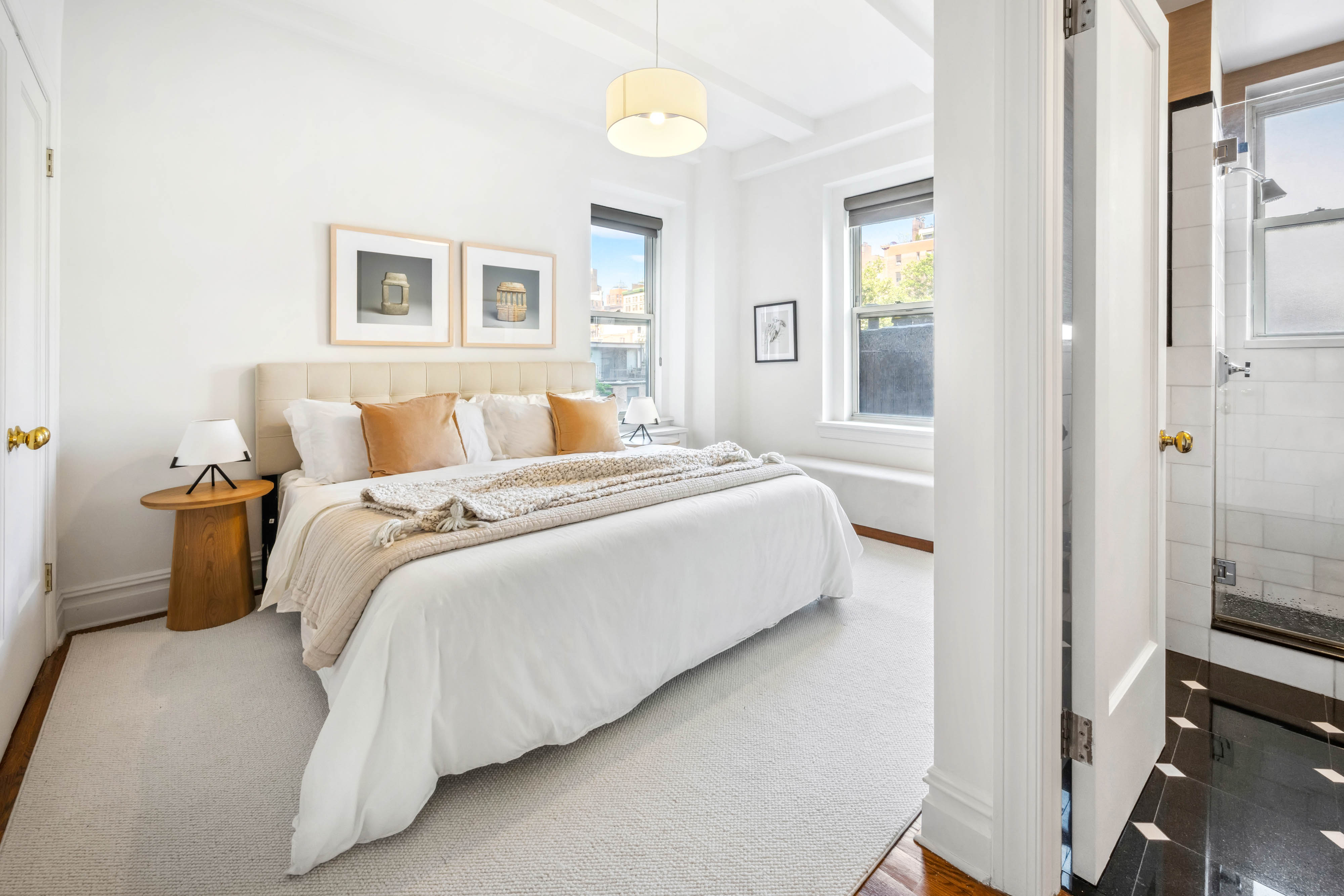 25 5th Avenue, Unit 6C Manhattan, NY 10003 - Photo 7 of 16 a bedroom with a bed and a window