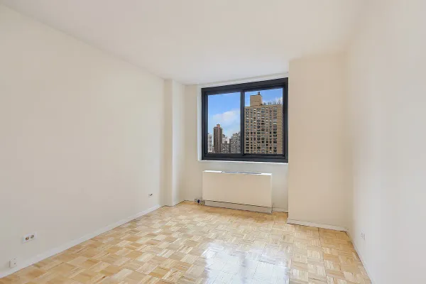 a view of an empty room with a window