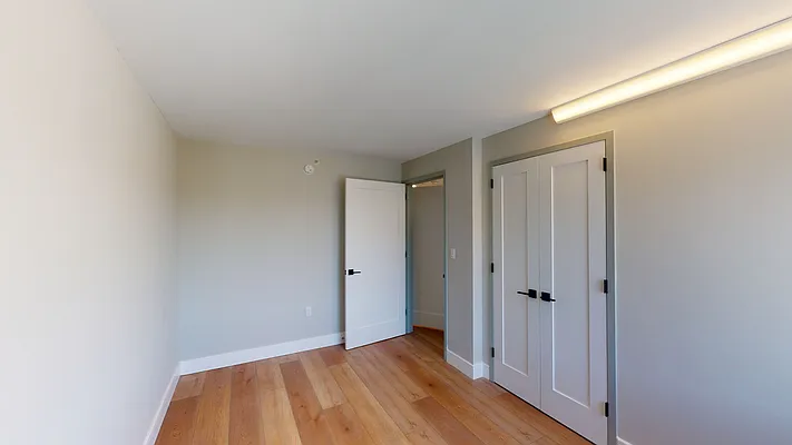 605 Hart Street, Unit 506 Brooklyn, NY 11221 - Photo 5 of 12 a view of hallway with wooden floor