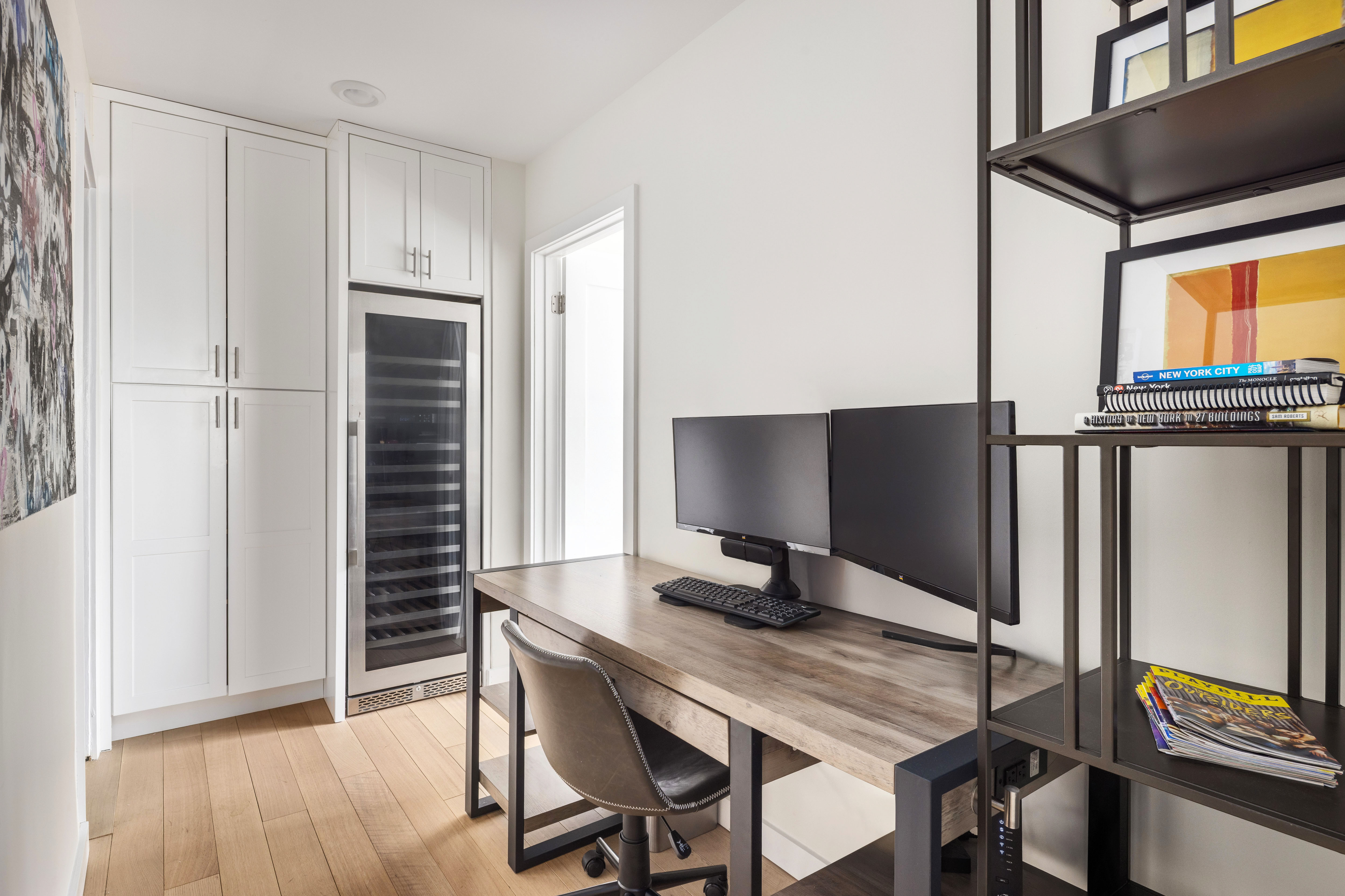 159 West 53rd Street, Unit 34E Manhattan, NY 10019 - Photo 13 of 15 a view of a workspace with furniture and wooden floor