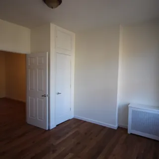 a view of a livingroom with wooden floor