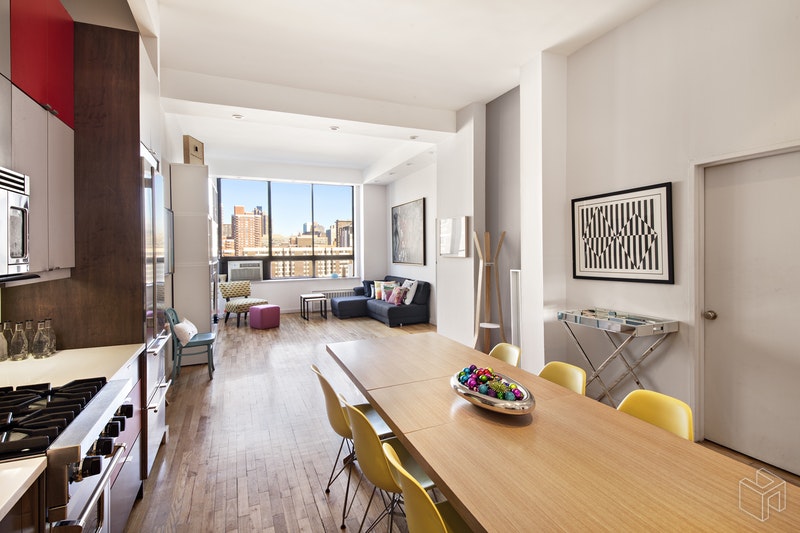 310 East 23rd Street, Unit 11FG Manhattan, NY 10010 - Photo 2 of 9 a living room with furniture and a wooden floor