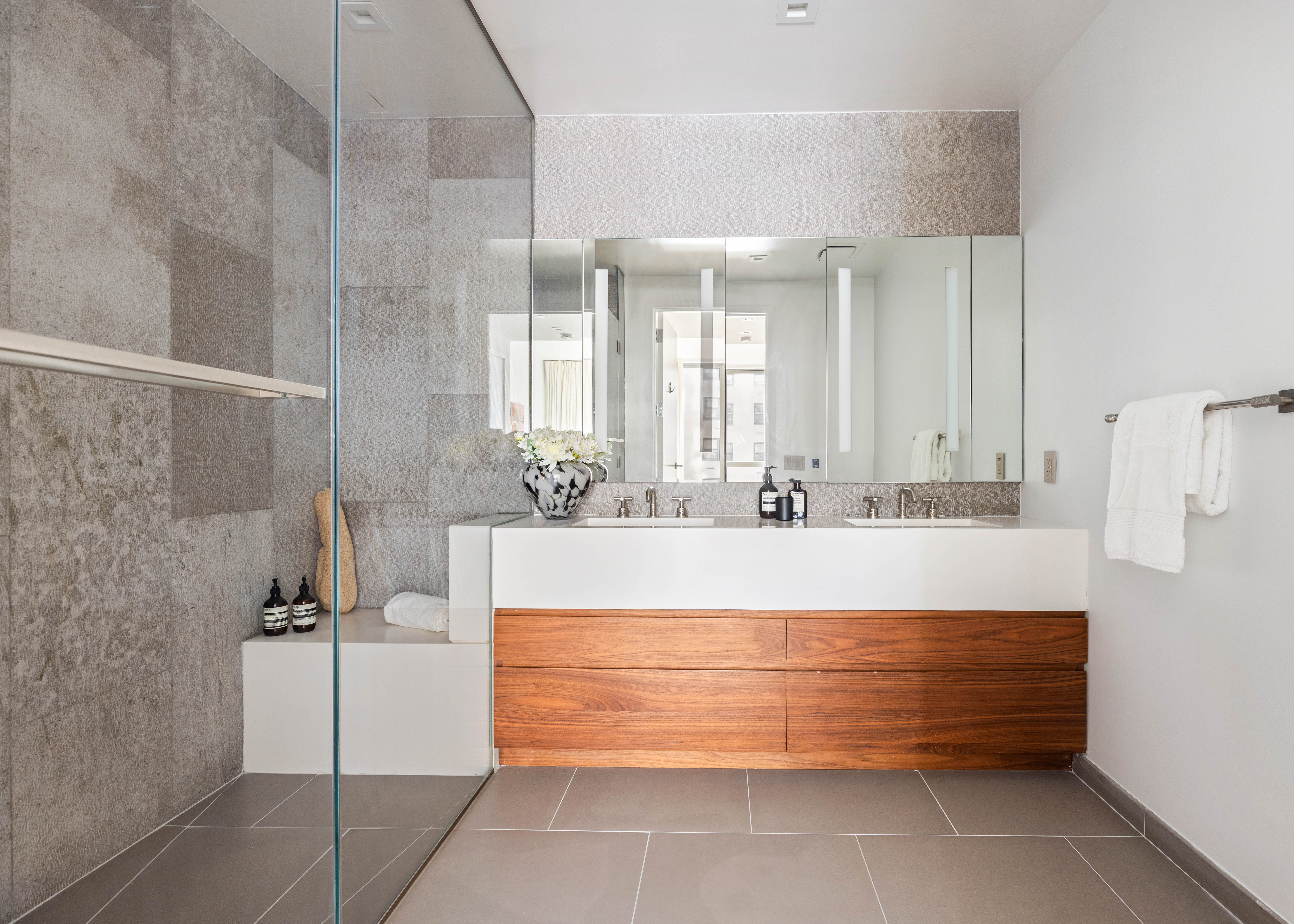 360 East 89th Street, Unit 5D Manhattan, NY 10128 - Photo 9 of 13 a bathroom with a tub sink and mirror