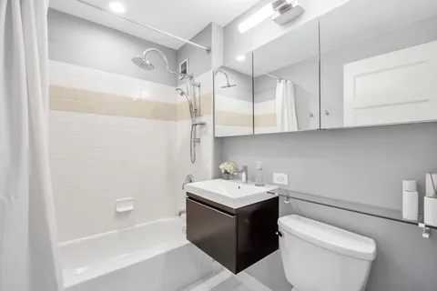a bathroom with a sink a toilet and a bathtub