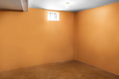 a view of a porch with wooden floor and iron stairs