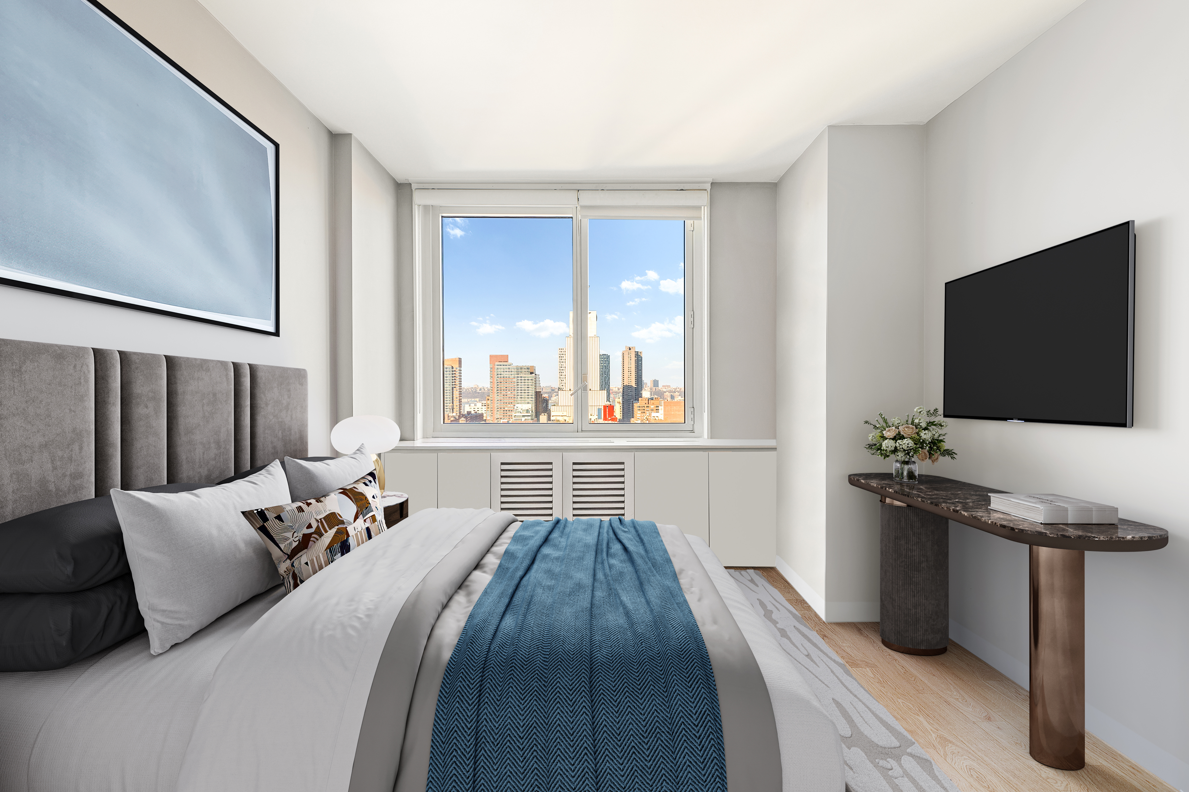 301 West 53rd Street, Unit 16D Manhattan, NY 10019 - Photo 5 of 16 a bedroom with a bed and a flat screen tv