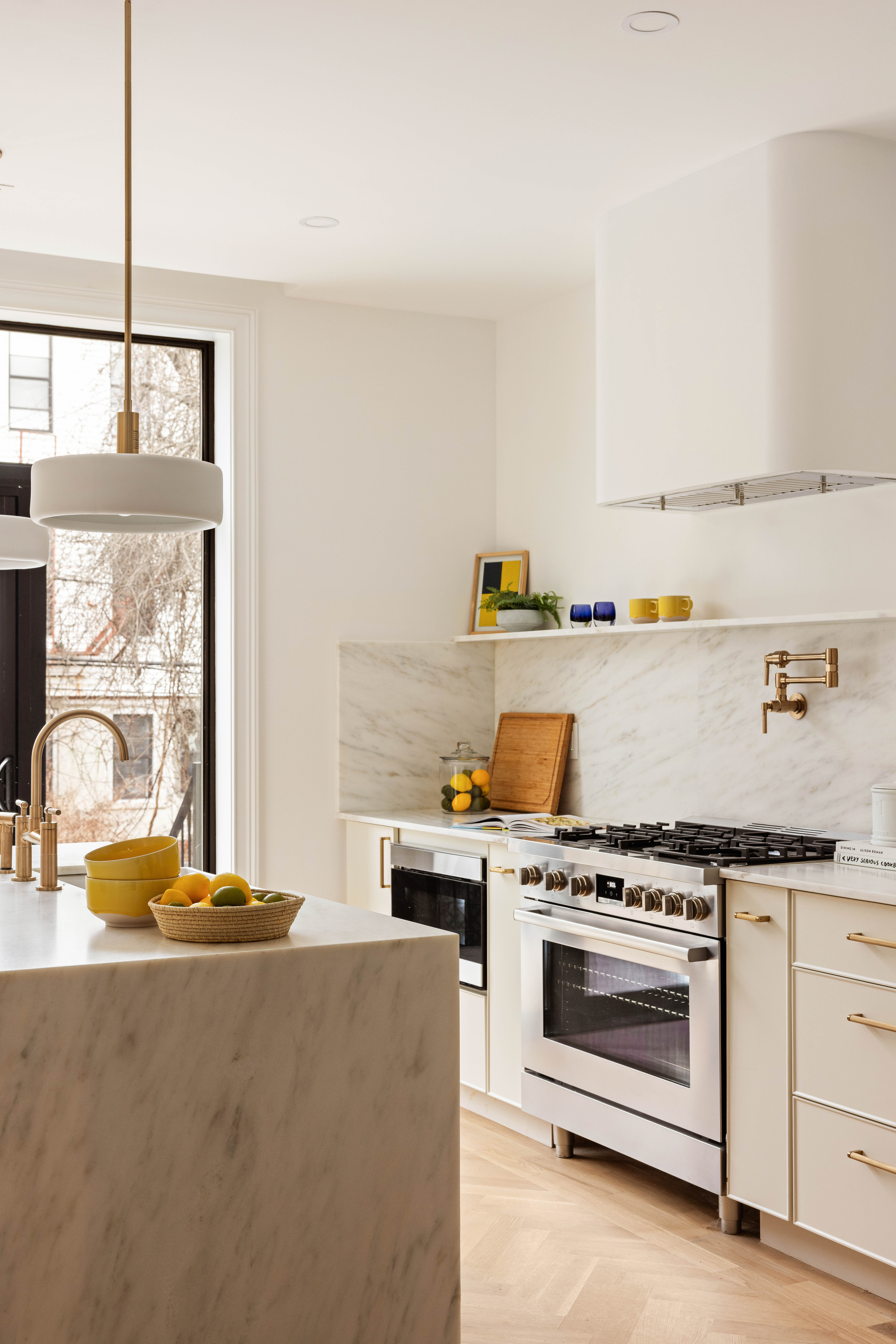 131 Weirfield Street Brooklyn, NY 11221 - Photo 4 of 14 a kitchen with a stove and white cabinets