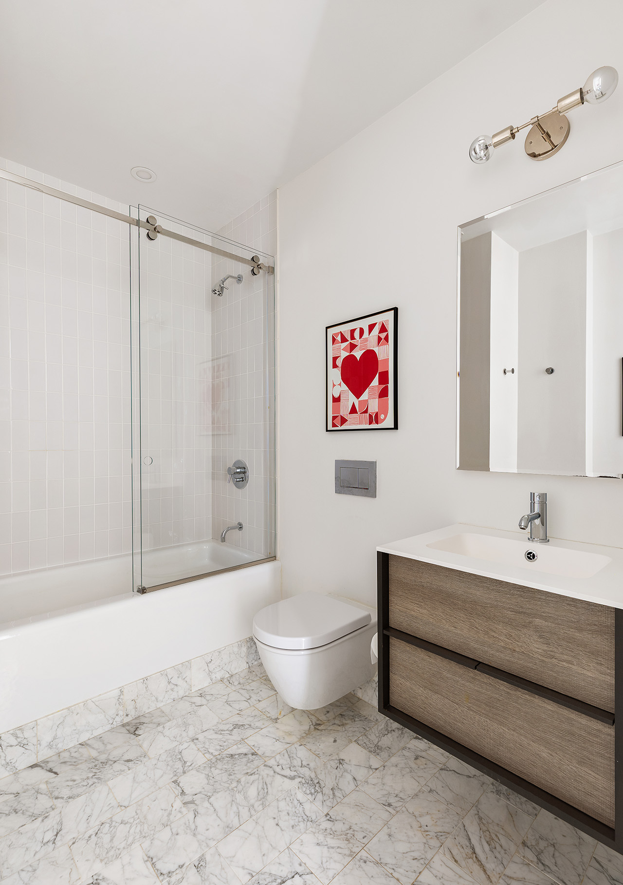 100 Hudson Street, Unit 7BC Manhattan, NY 10013 - Photo 16 of 20 a bathroom with a toilet sink and shower