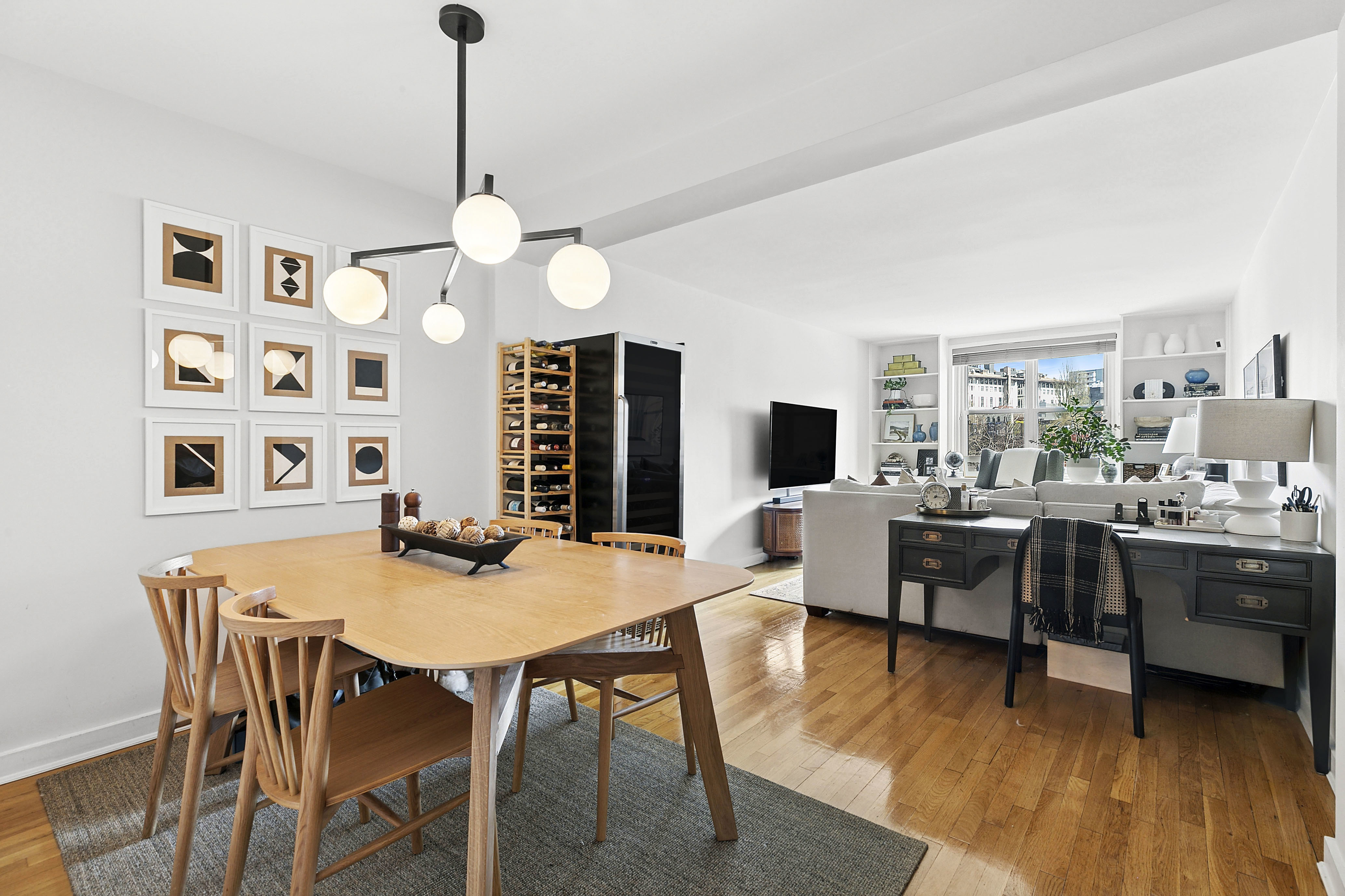 a view of a dining room with furniture and wooden floor