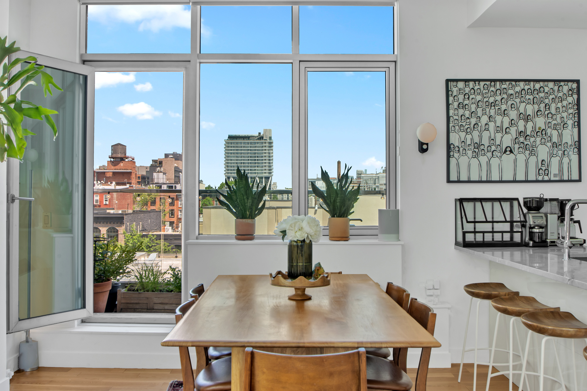 101 North 5th Street, Unit 5A Brooklyn, NY 11249 - Photo 7 of 26 a view of a dining room with furniture and a potted plant