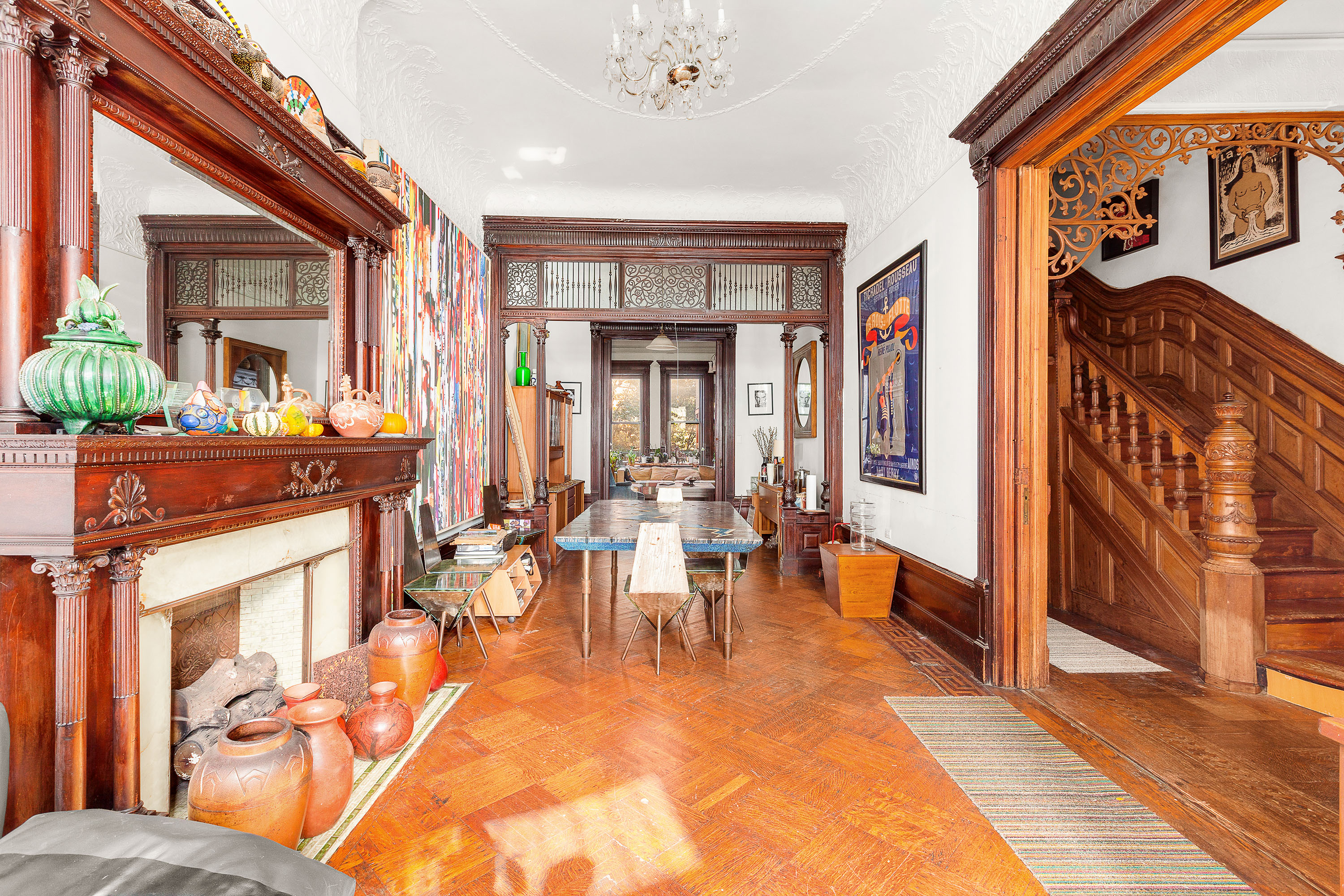 117 West 120th Street Manhattan, NY 10027 - Photo 9 of 31 a view of a dining room with furniture a chandelier and wooden floor