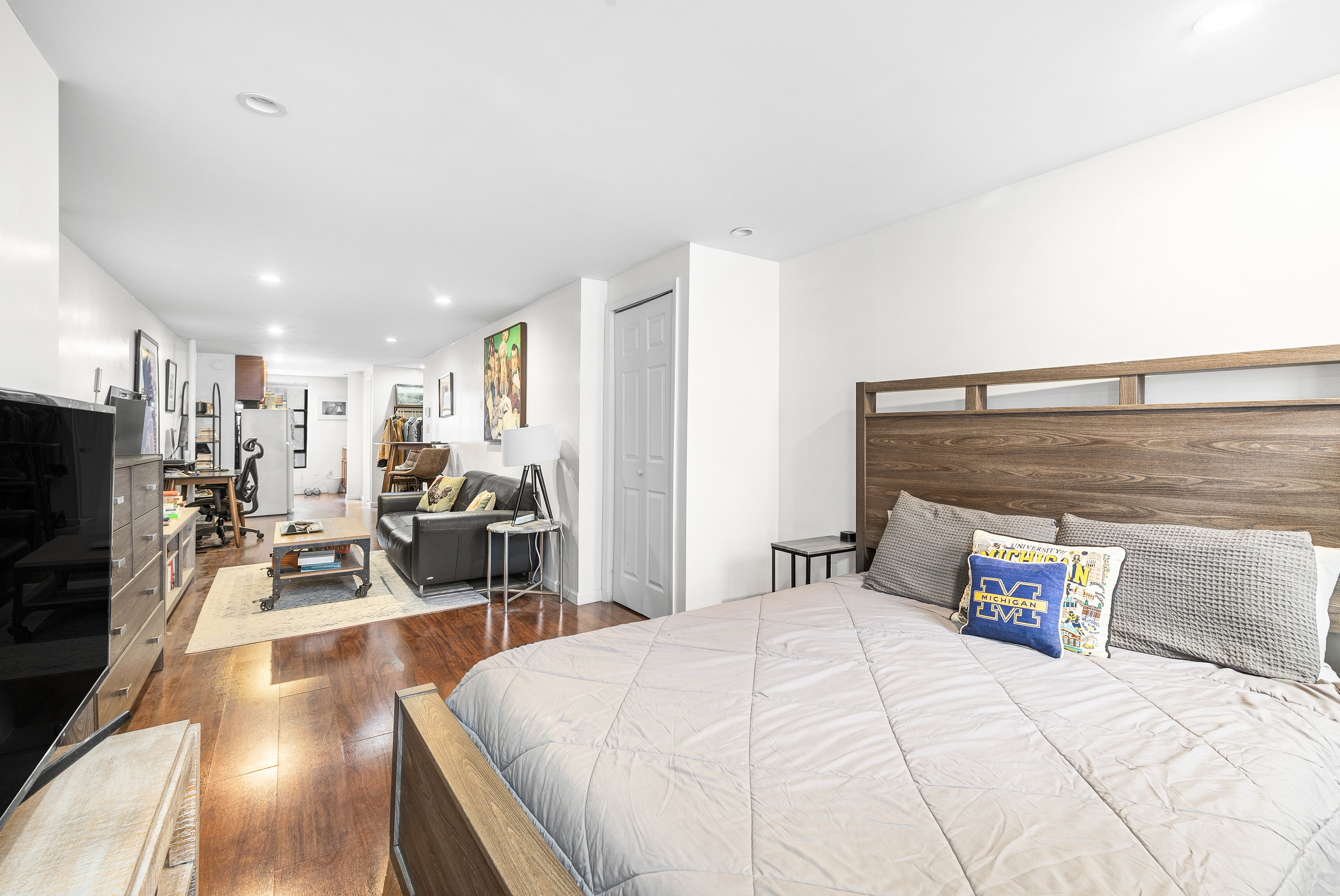 82 East 7th Street, Unit 2 Manhattan, NY 10003 - Photo 3 of 11 a spacious bedroom with a bed and a flat screen tv