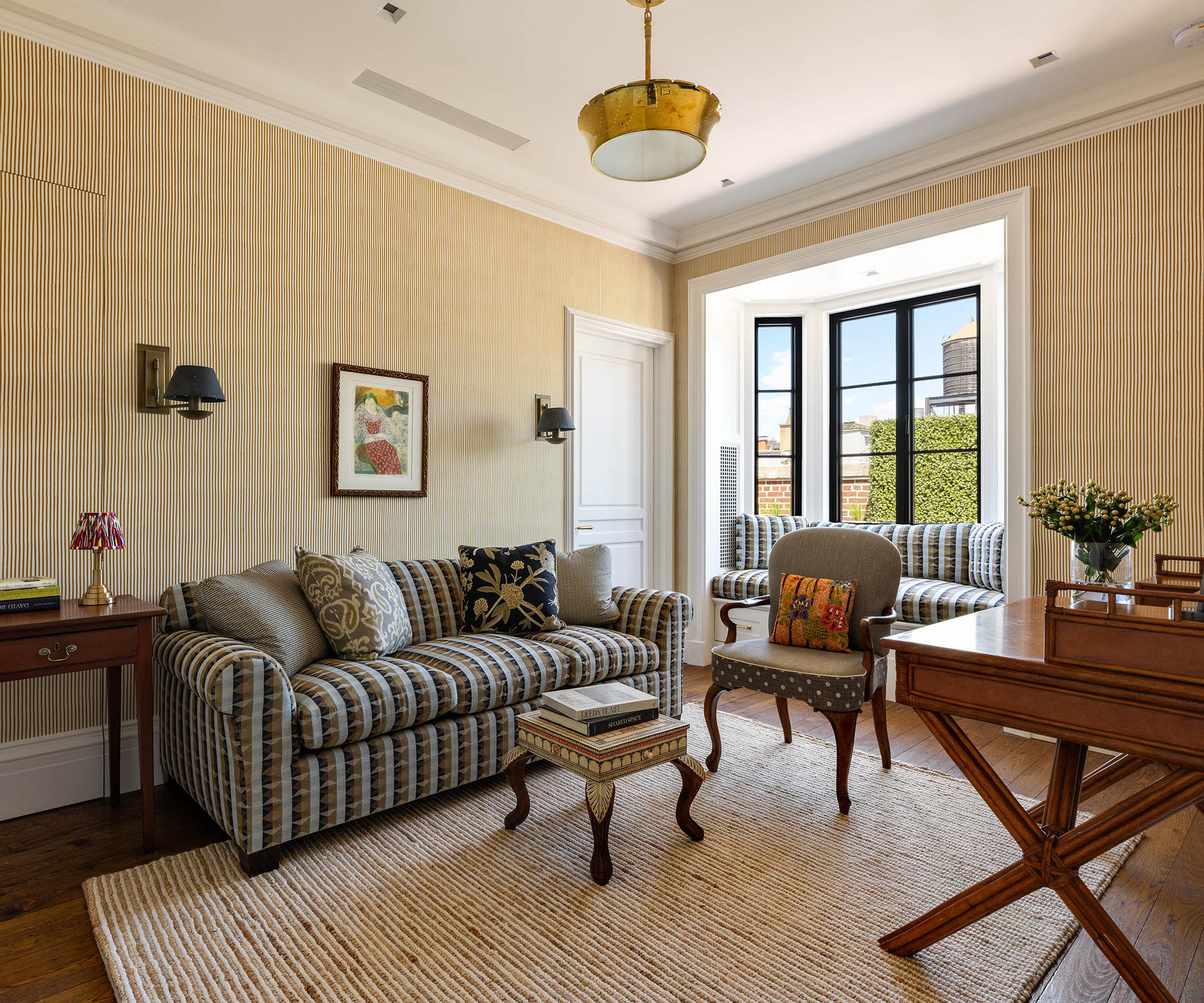 150 East 73rd Street, Unit PH Manhattan, NY 10021 - Photo 18 of 29 a living room with furniture and a large window
