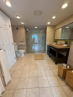 a kitchen with stainless steel appliances kitchen island granite countertop a sink and cabinets