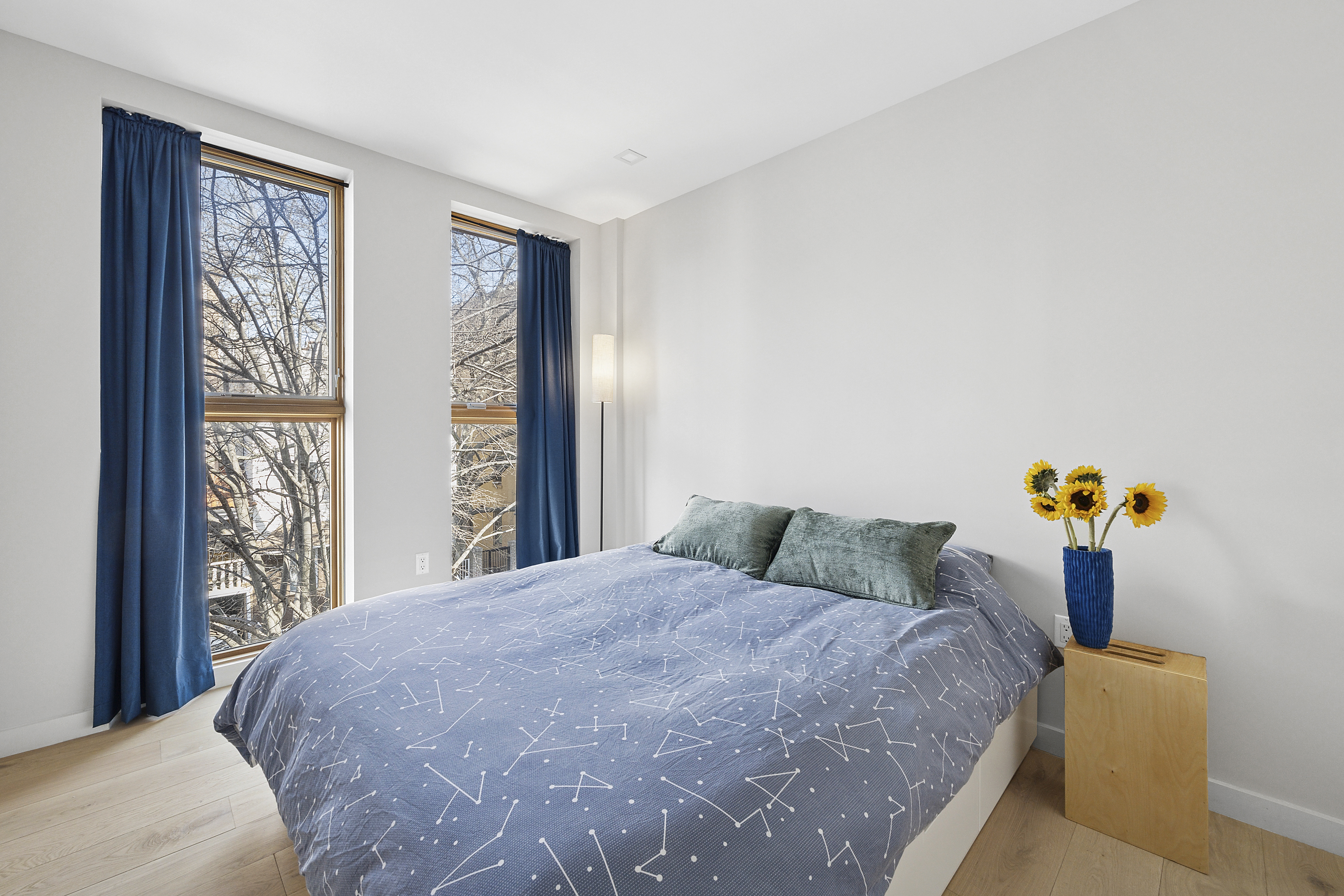 156 Devoe Street, Unit 3F Brooklyn, NY 11211 - Photo 5 of 9 a bedroom with a bed and a window