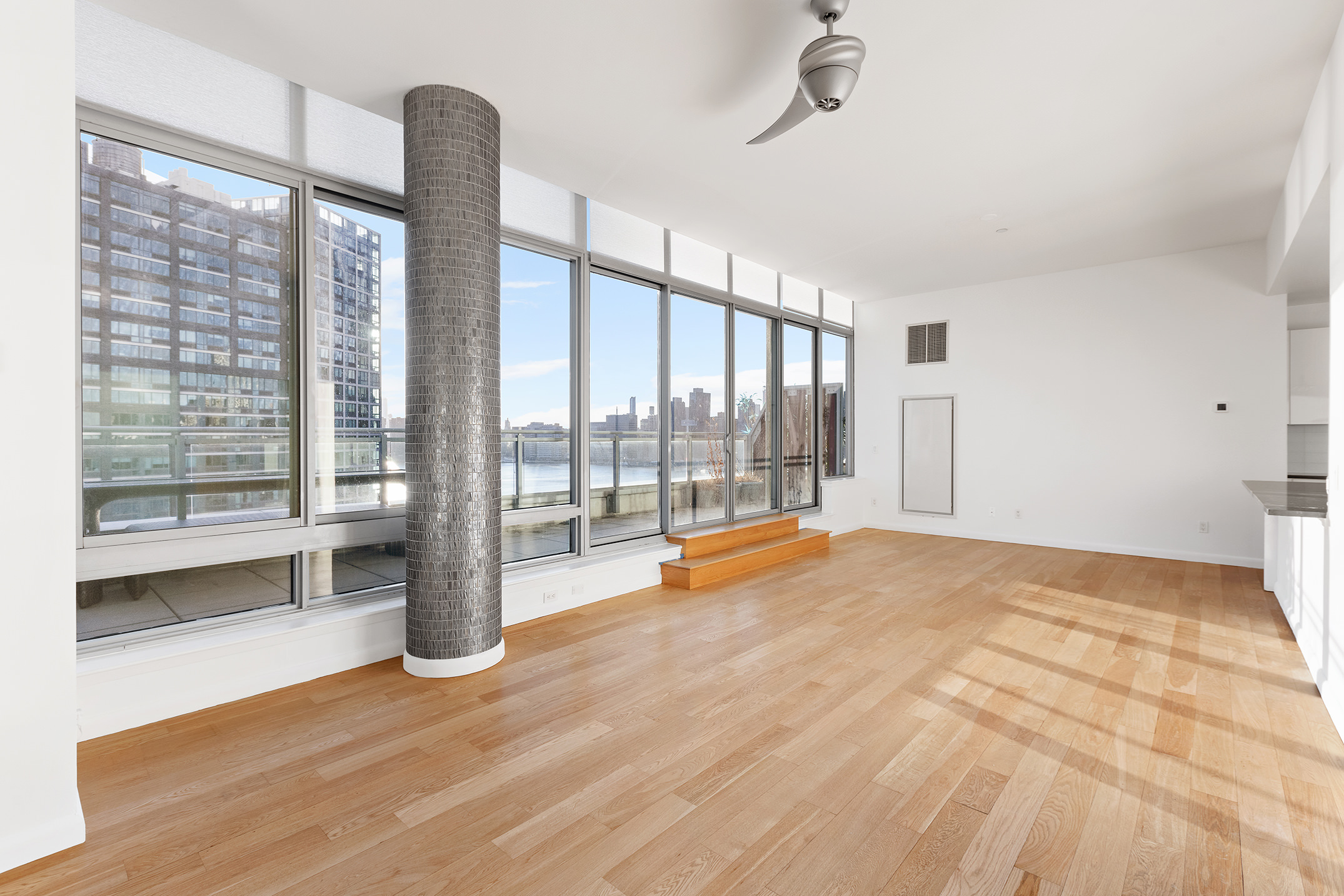 46-30 Center Boulevard, Unit PH8 Queens, NY 11109 - Photo 2 of 32 a view of an empty room with glass door