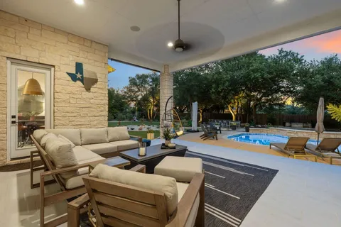 a view of a patio with swimming pool
