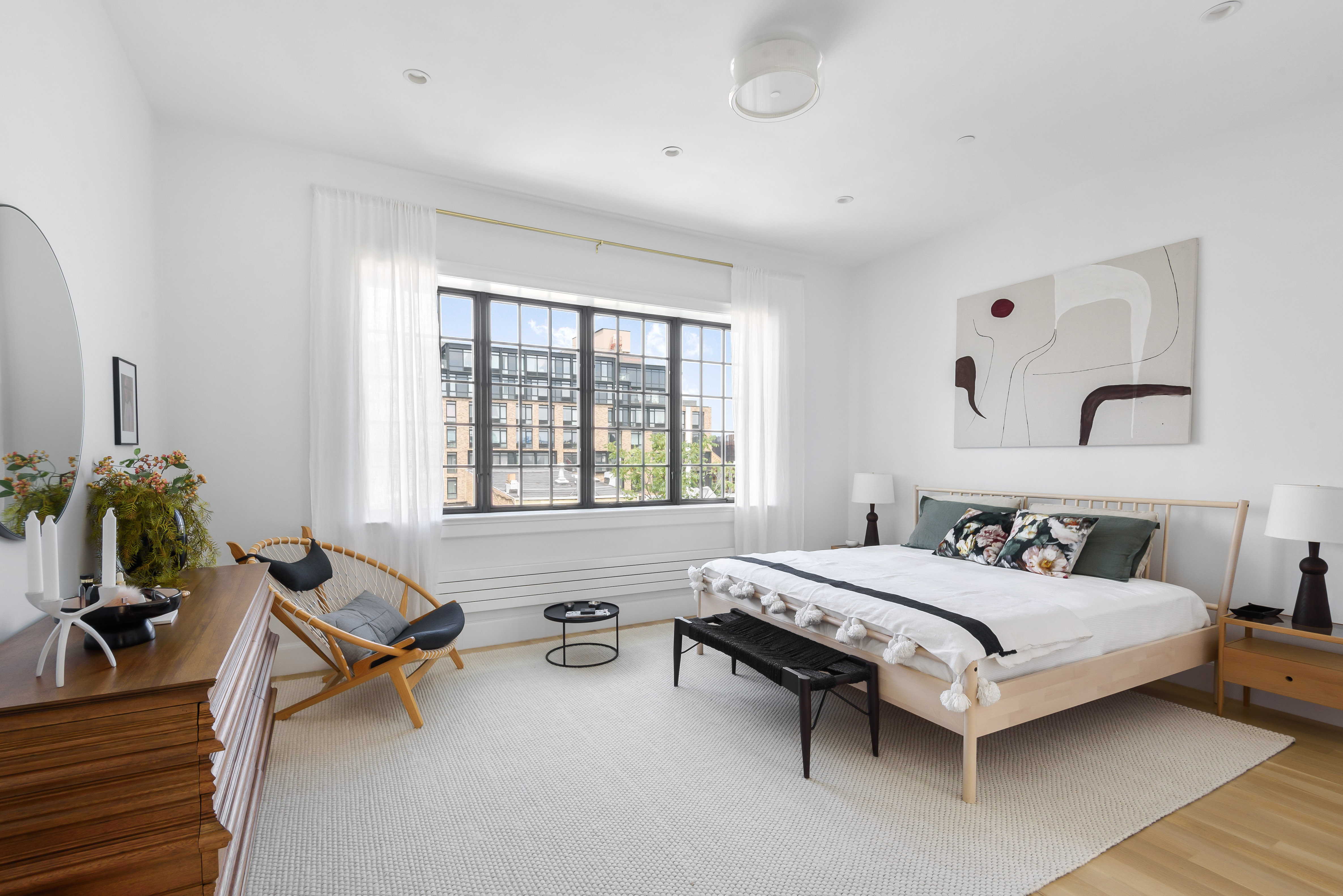 179 Devoe Street, Unit 2 Brooklyn, NY 11211 - Photo 5 of 19 a bedroom with a bed and a table chair