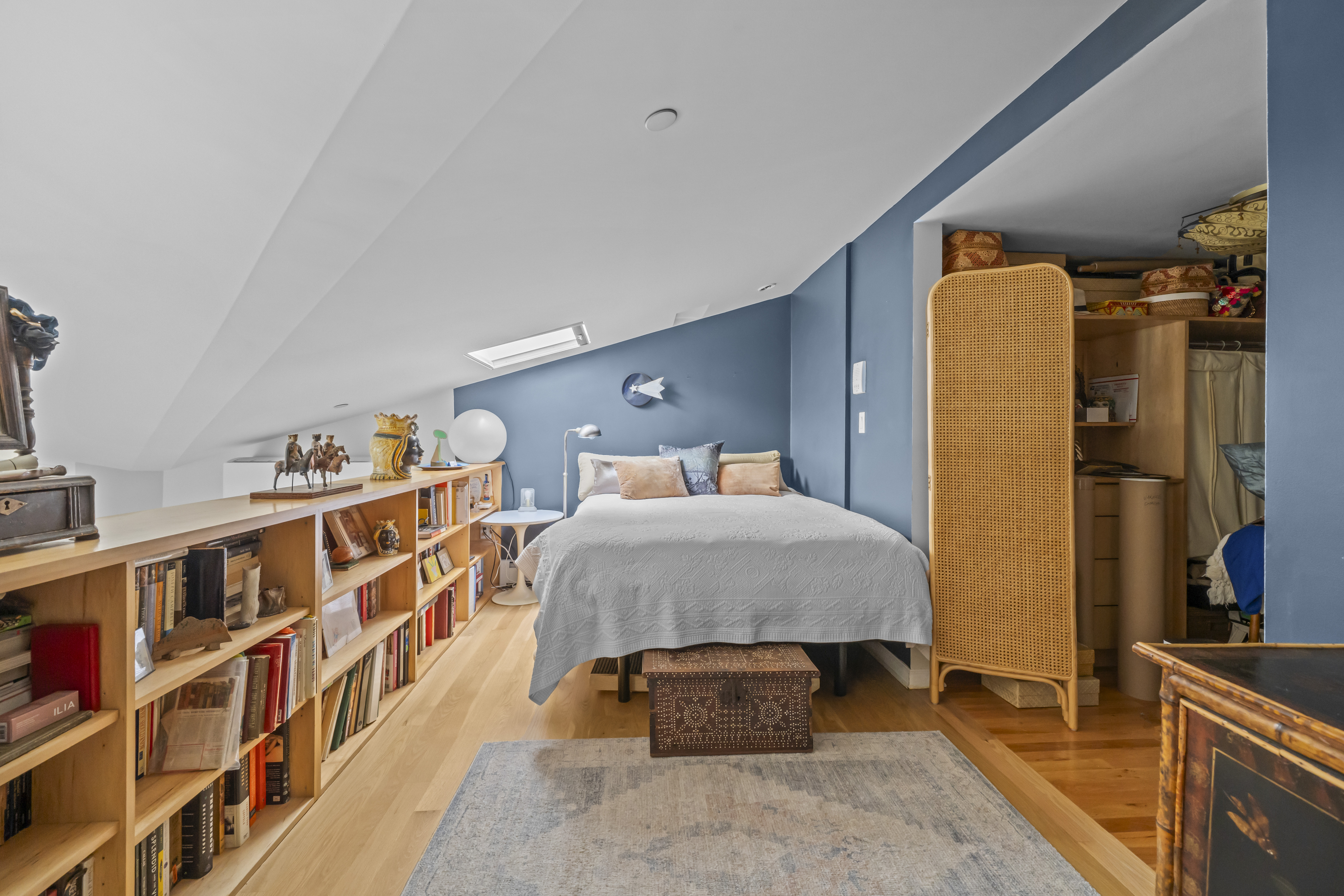 368 12th Street, Unit 5 Brooklyn, NY 11215 - Photo 8 of 11 a bedroom with a bed and a book shelf