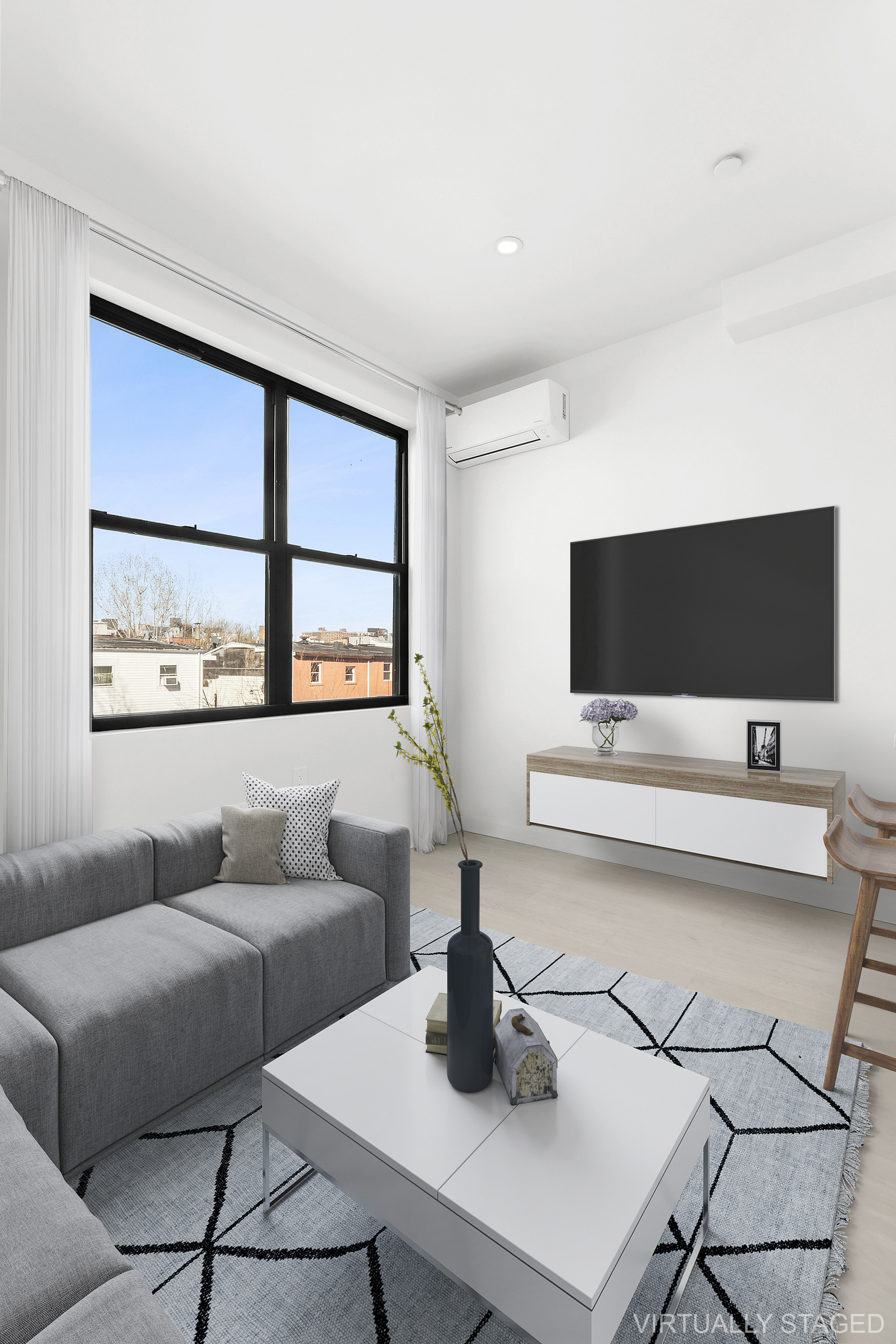 647 Dekalb Avenue, Unit 4B Brooklyn, NY 11216 - Photo 2 of 8 a living room with furniture and a flat screen tv