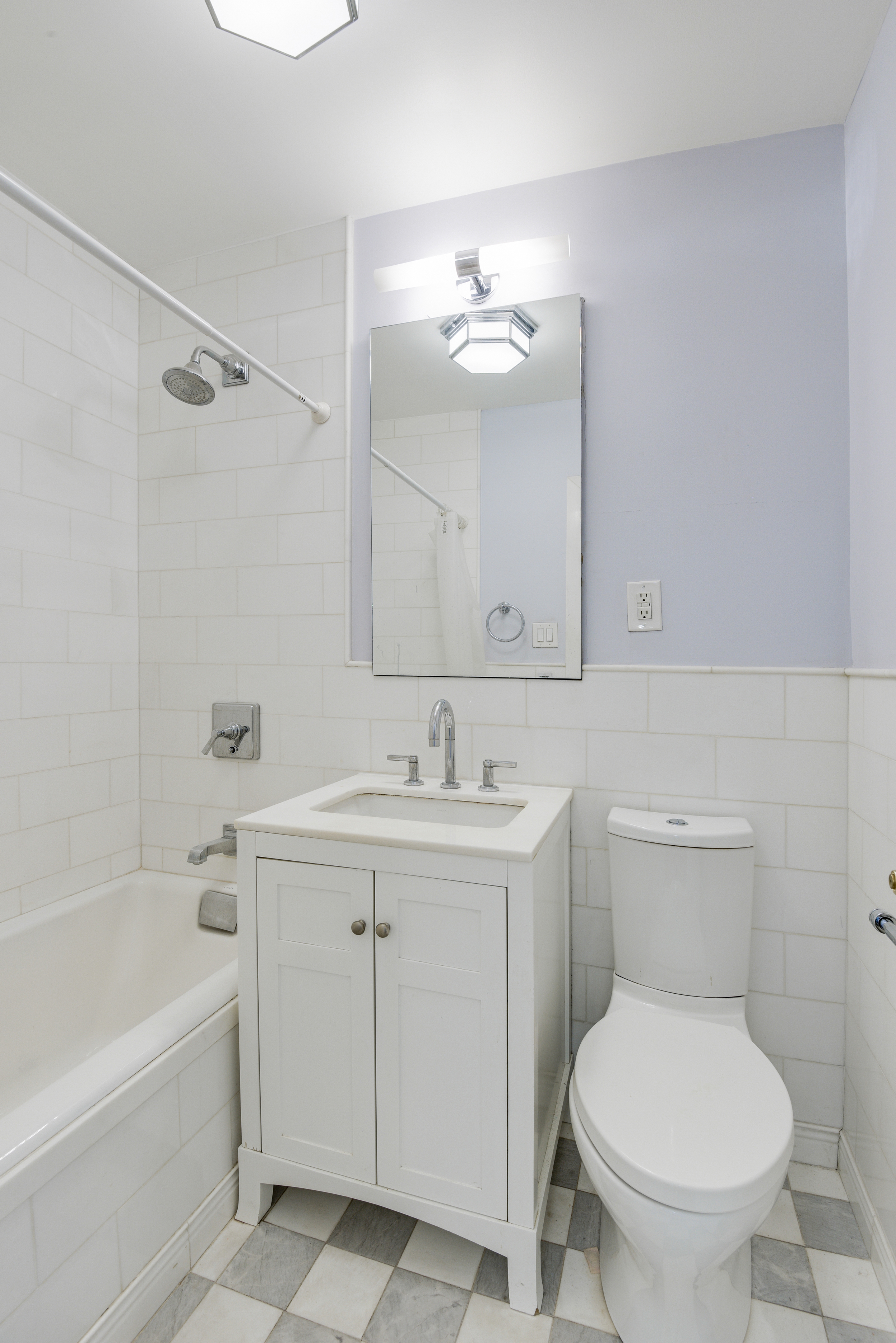 16 Sutton Place, Unit 2B Manhattan, NY 10022 - Photo 11 of 20 a bathroom with a sink a toilet and shower