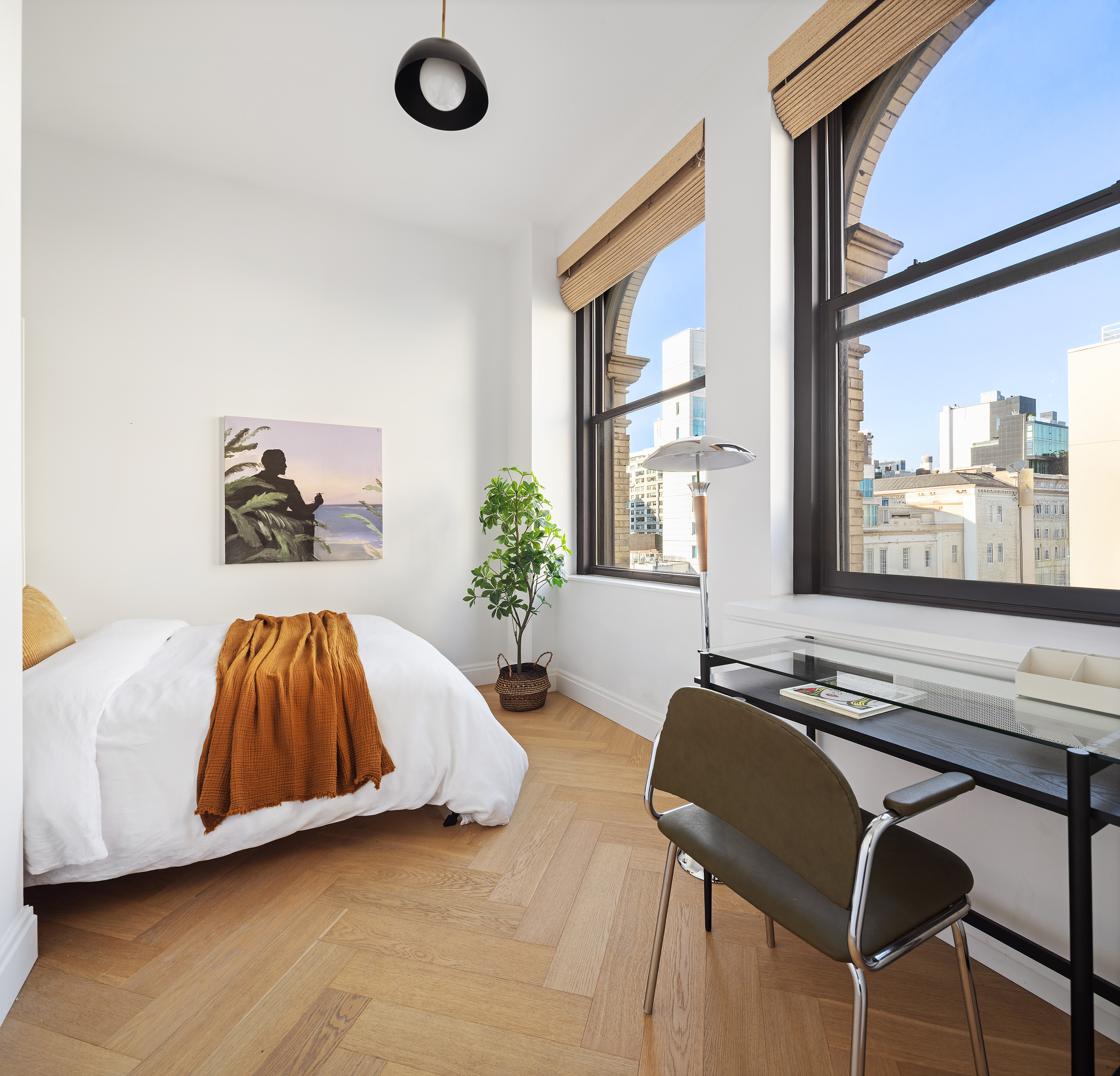 48 East 13th Street, Unit 8B Manhattan, NY 10003 - Photo 12 of 14 a living room with a couch and a large window