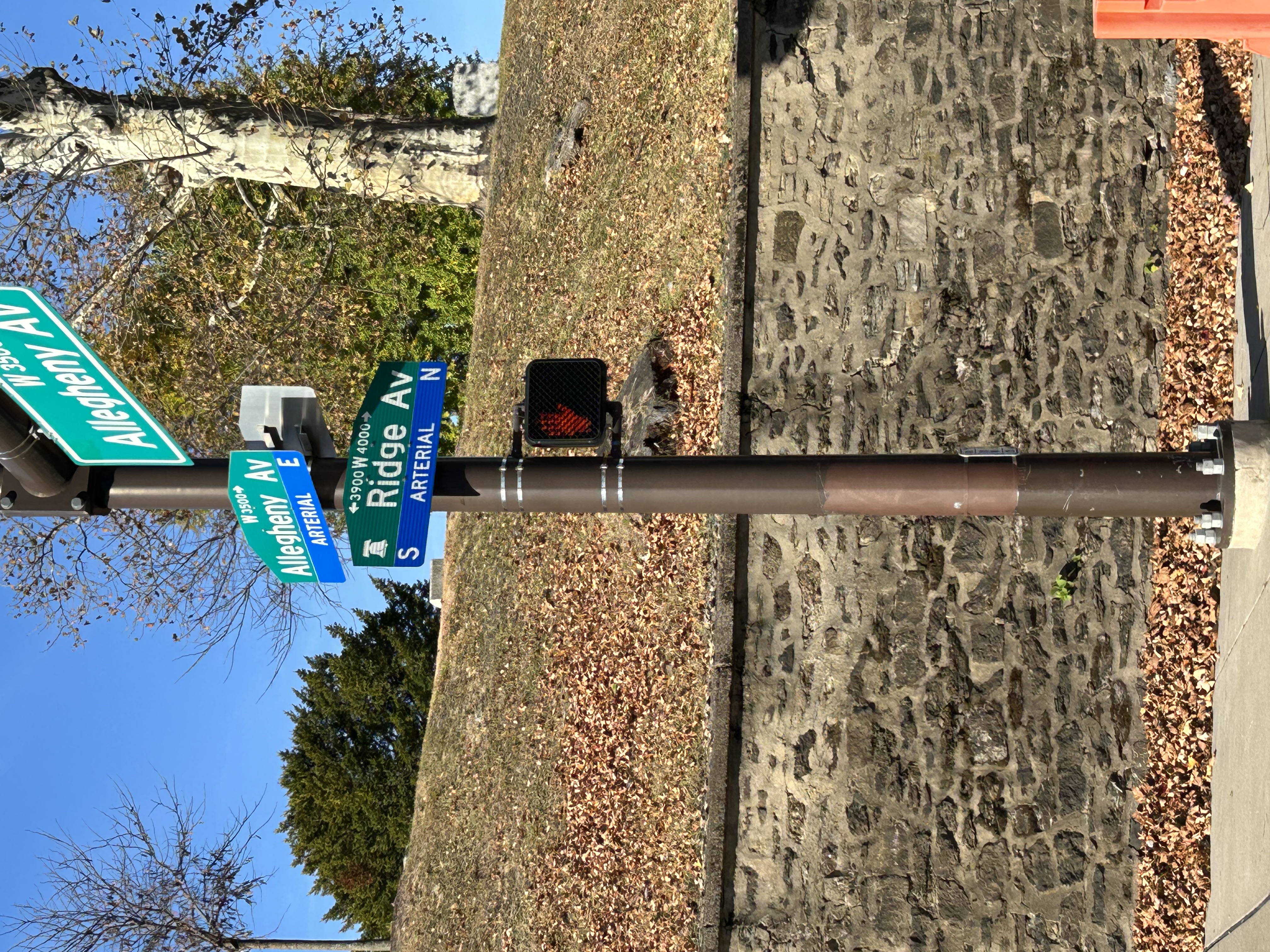 3929 Ridge Avenue Philadelphia, PA 19132 - Photo 10 of 13 a street sign on a wall next to a road