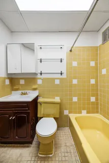 a bathroom with a sink a bathtub and a toilet